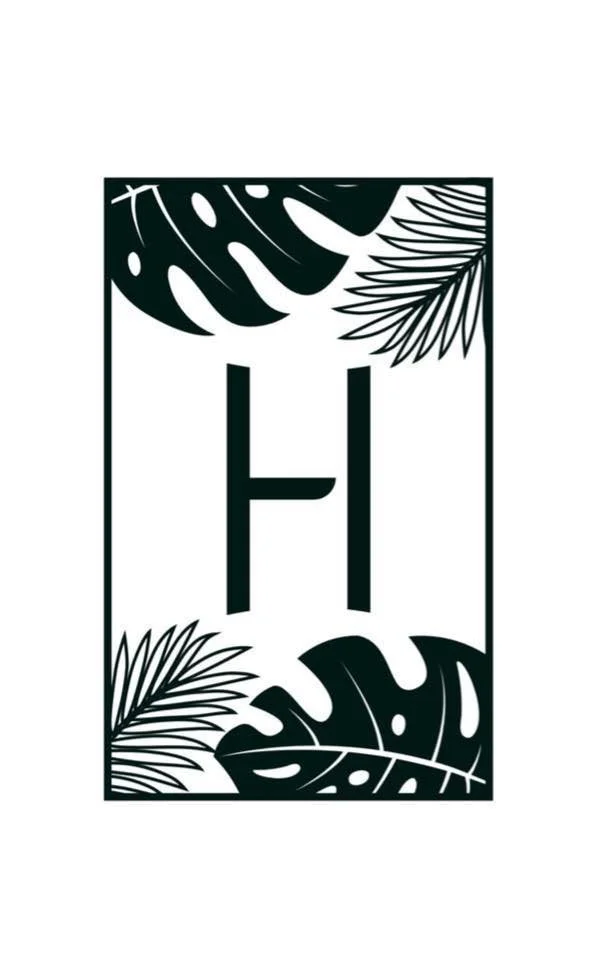 Letter 'H' surrounded by tropical leaves in black and white