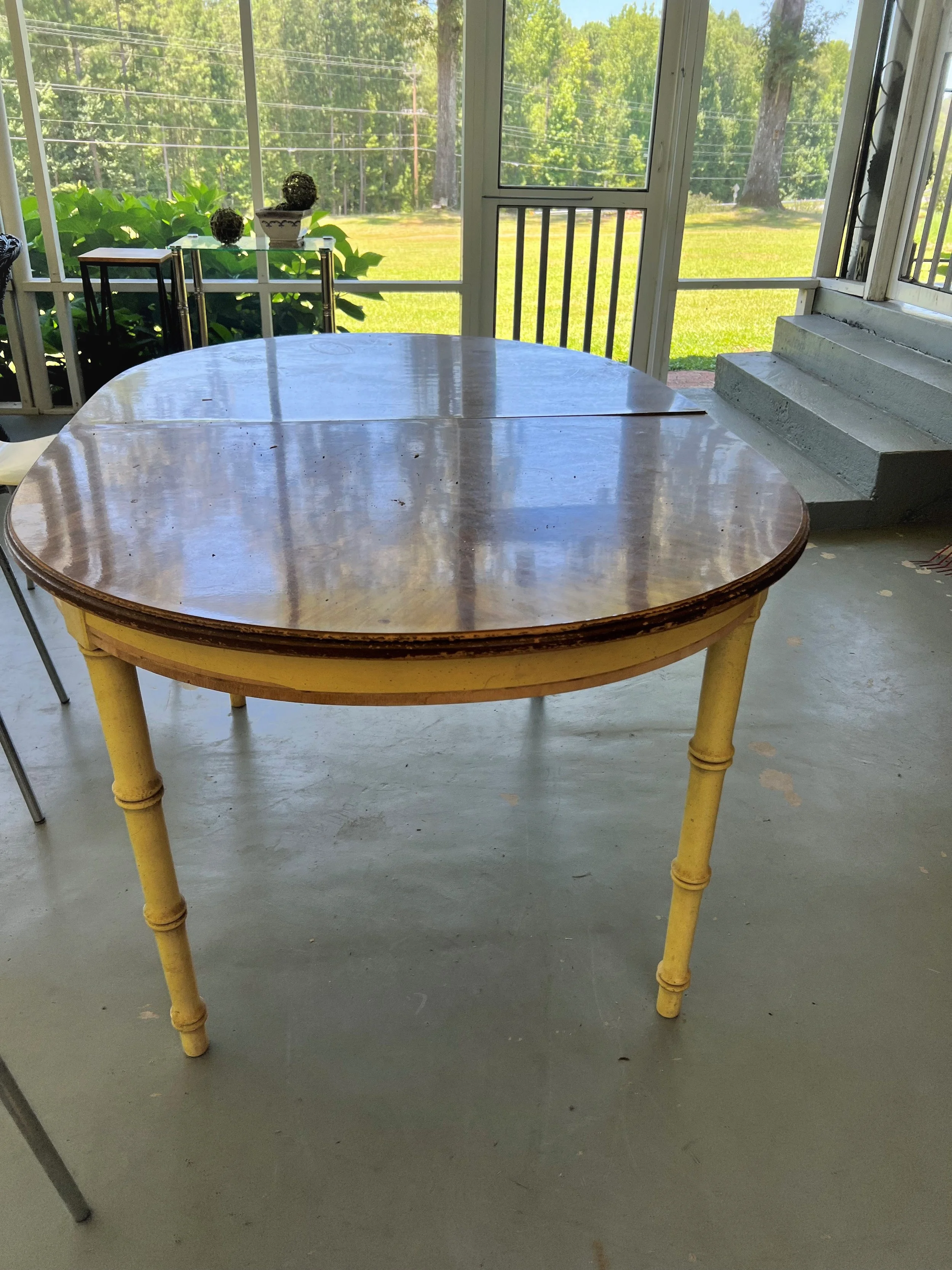 Completed vintage rattan table restoration with BEHR paint