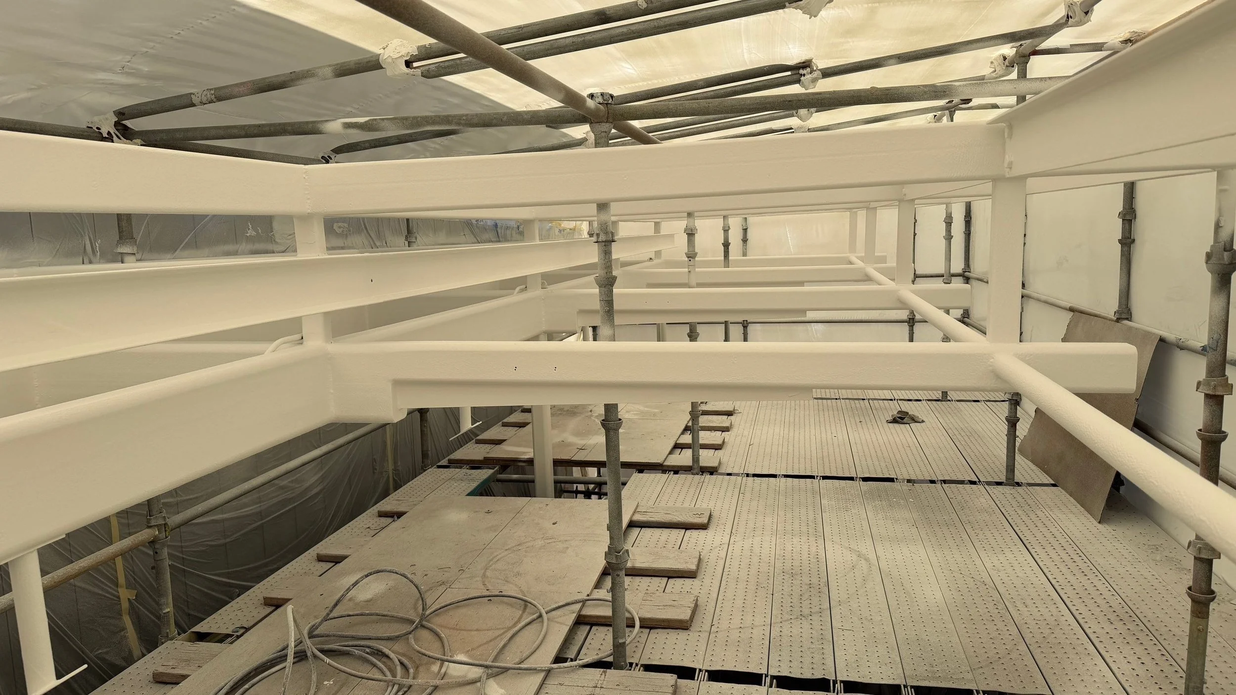 “Intumescent coating in Seattle – application in progress on structural steel”
