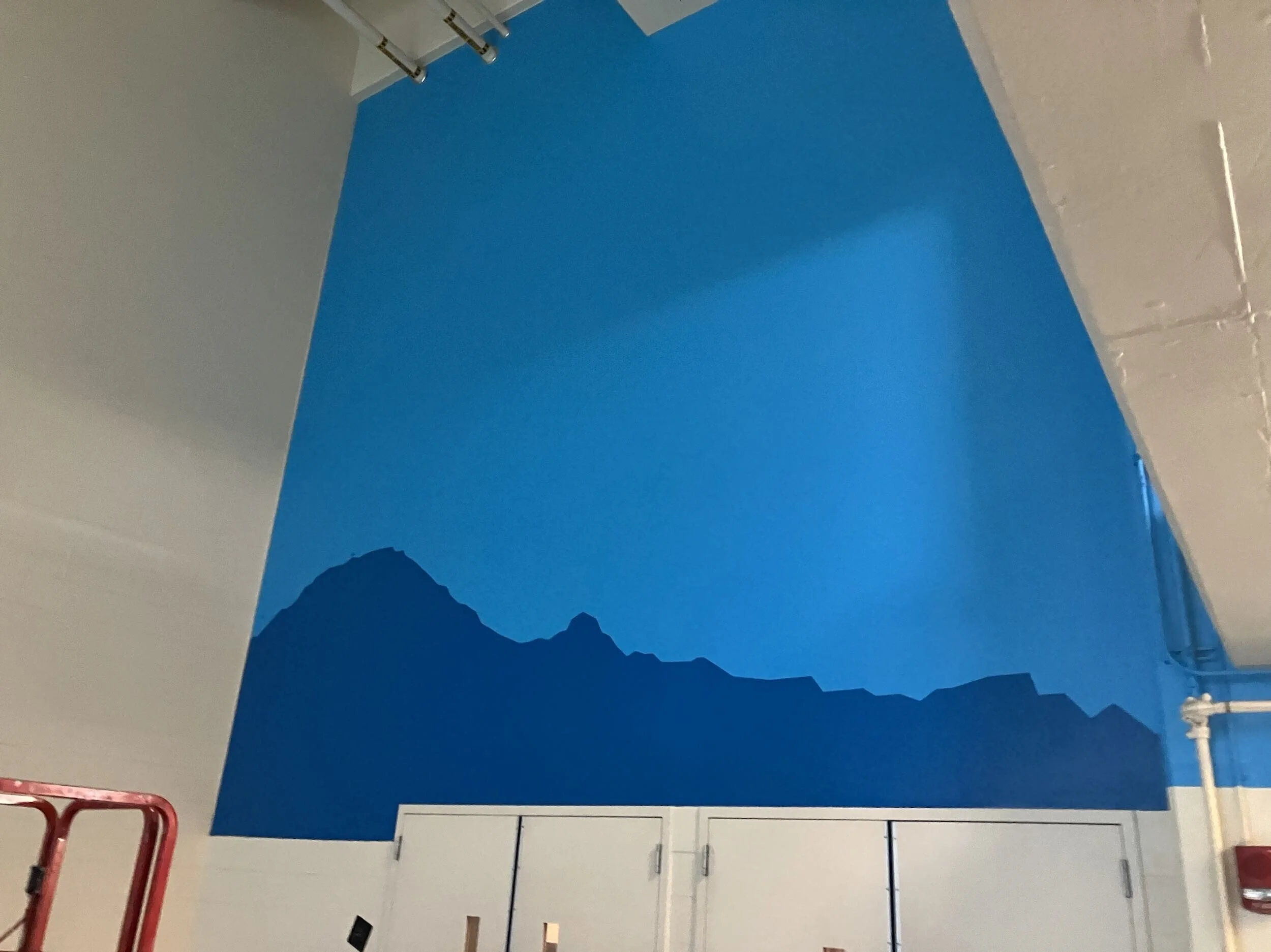 “Painted wall graphic in Seattle – completed mountain design on stadium wall”