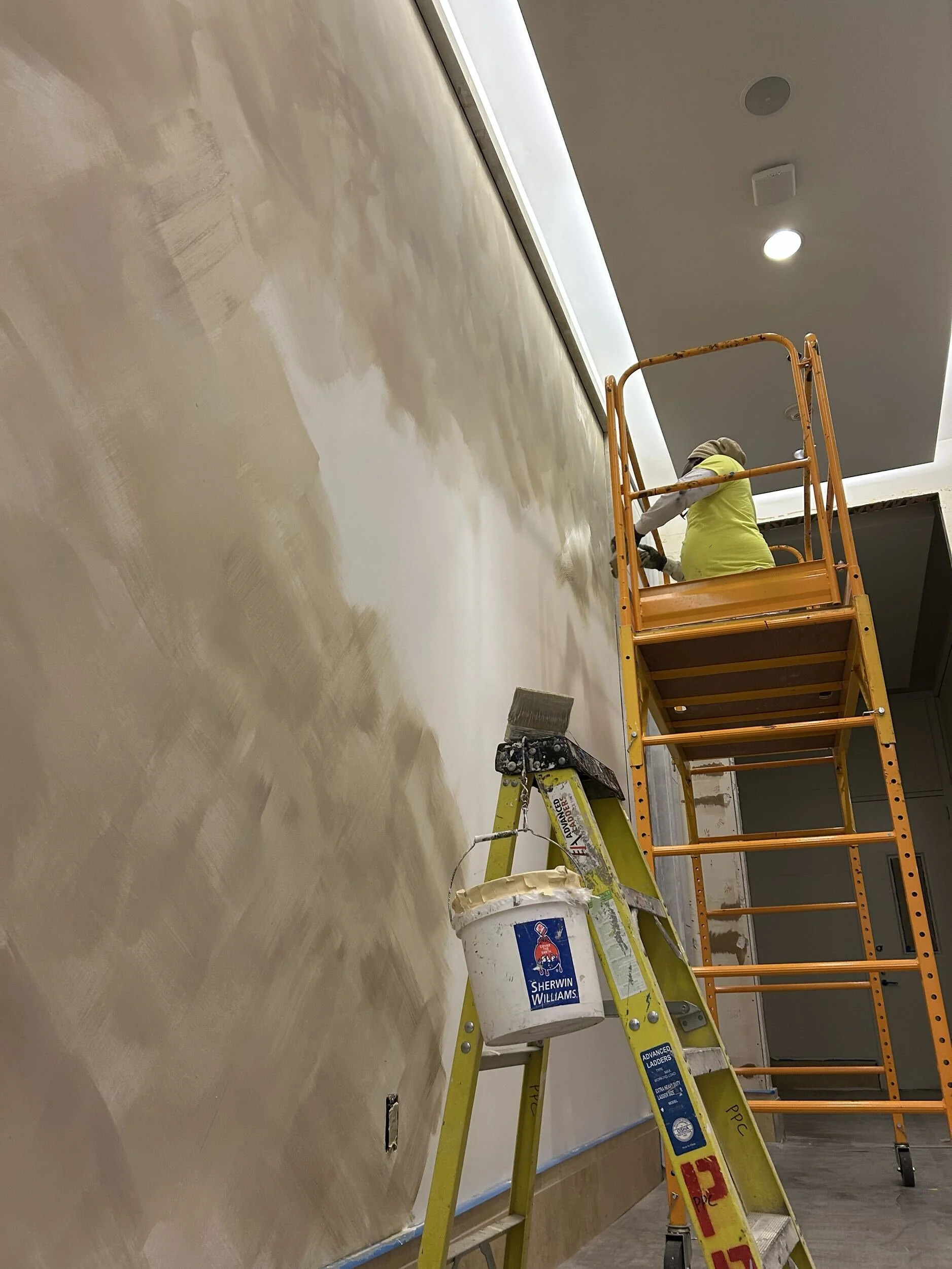 limewash painting in seattle – lobby walls being painted in a hotel