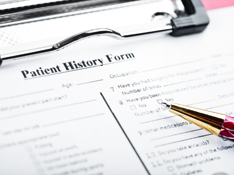 blank patient history form on clipboard