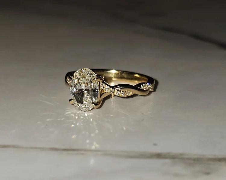 Custom oval cut diamond engagement ring