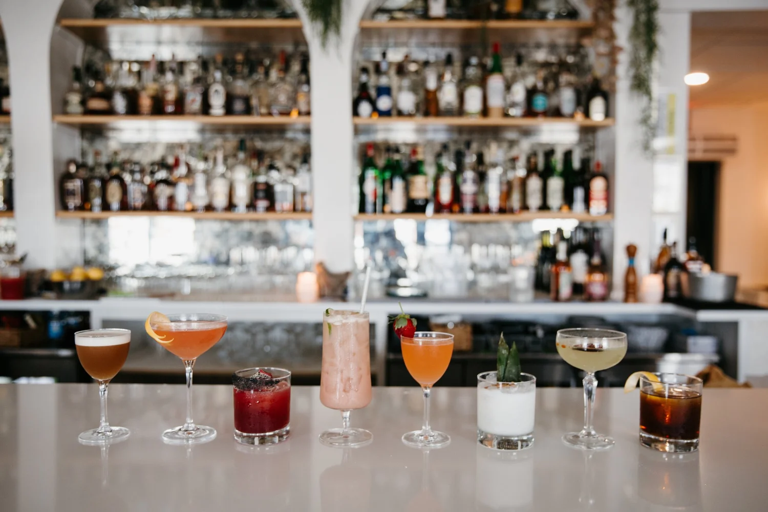 Hen House cocktails lined up along the bar