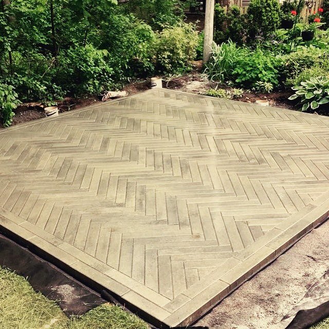 A backyard corner patio using harringbone pattern with #techobloc Industria 600x100 Shale grey  Just the finishing touches needed! #hardscape #landscaping #eskapes #backyard #design #harringbone #patio #outdoorspace
