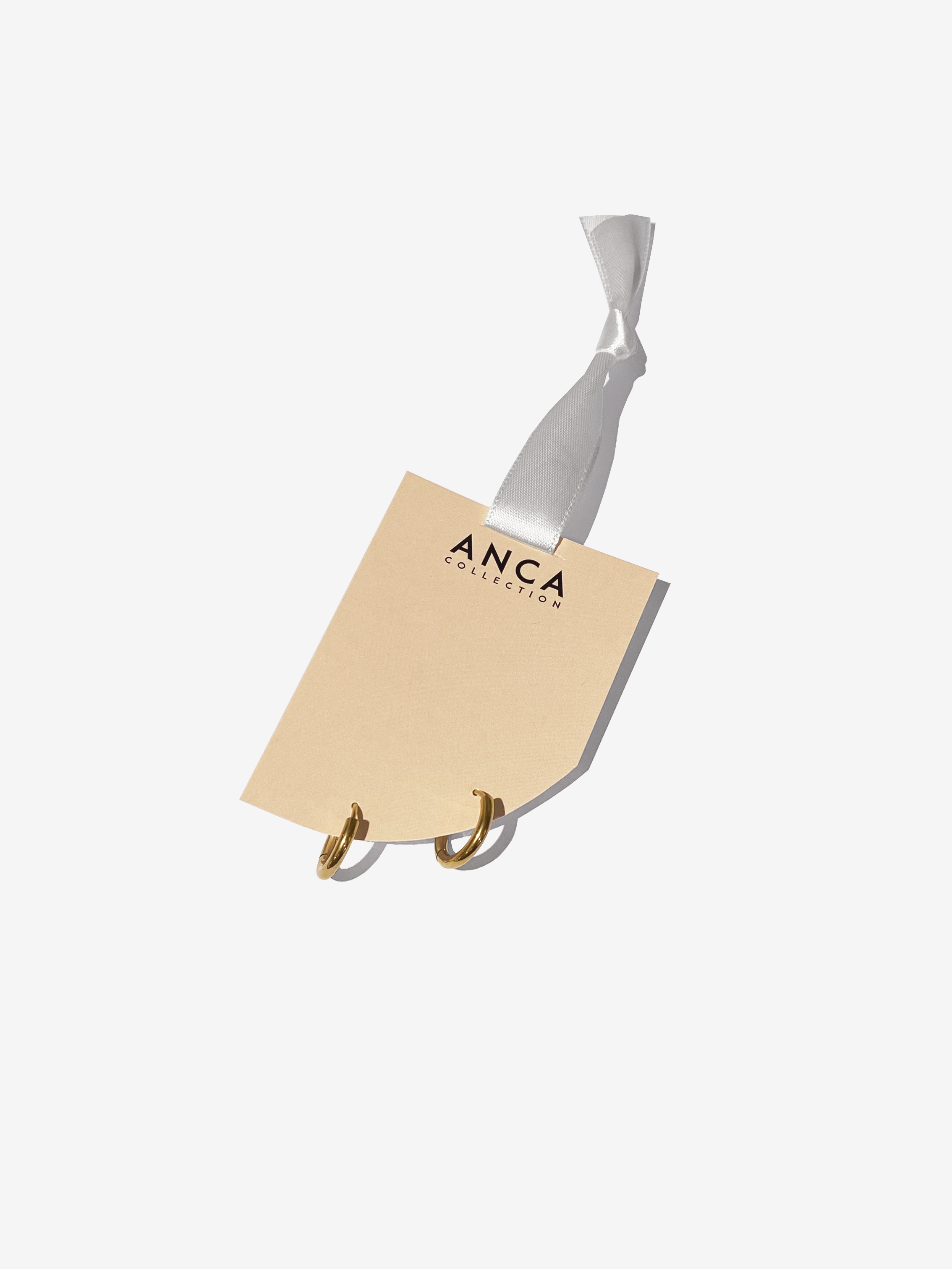 Gold Everyday Huggie Hoops.png