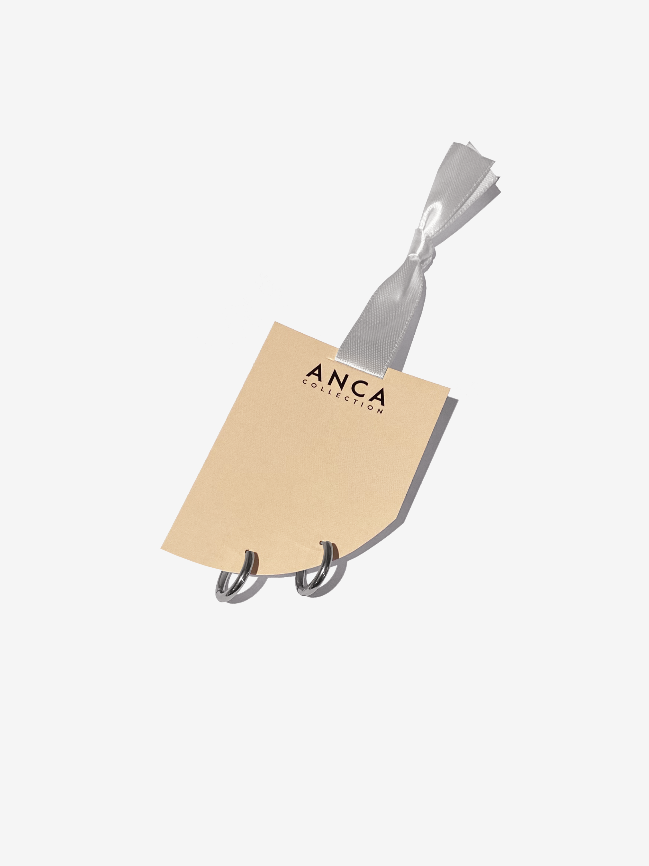 Silver Everyday Huggie Hoops.png
