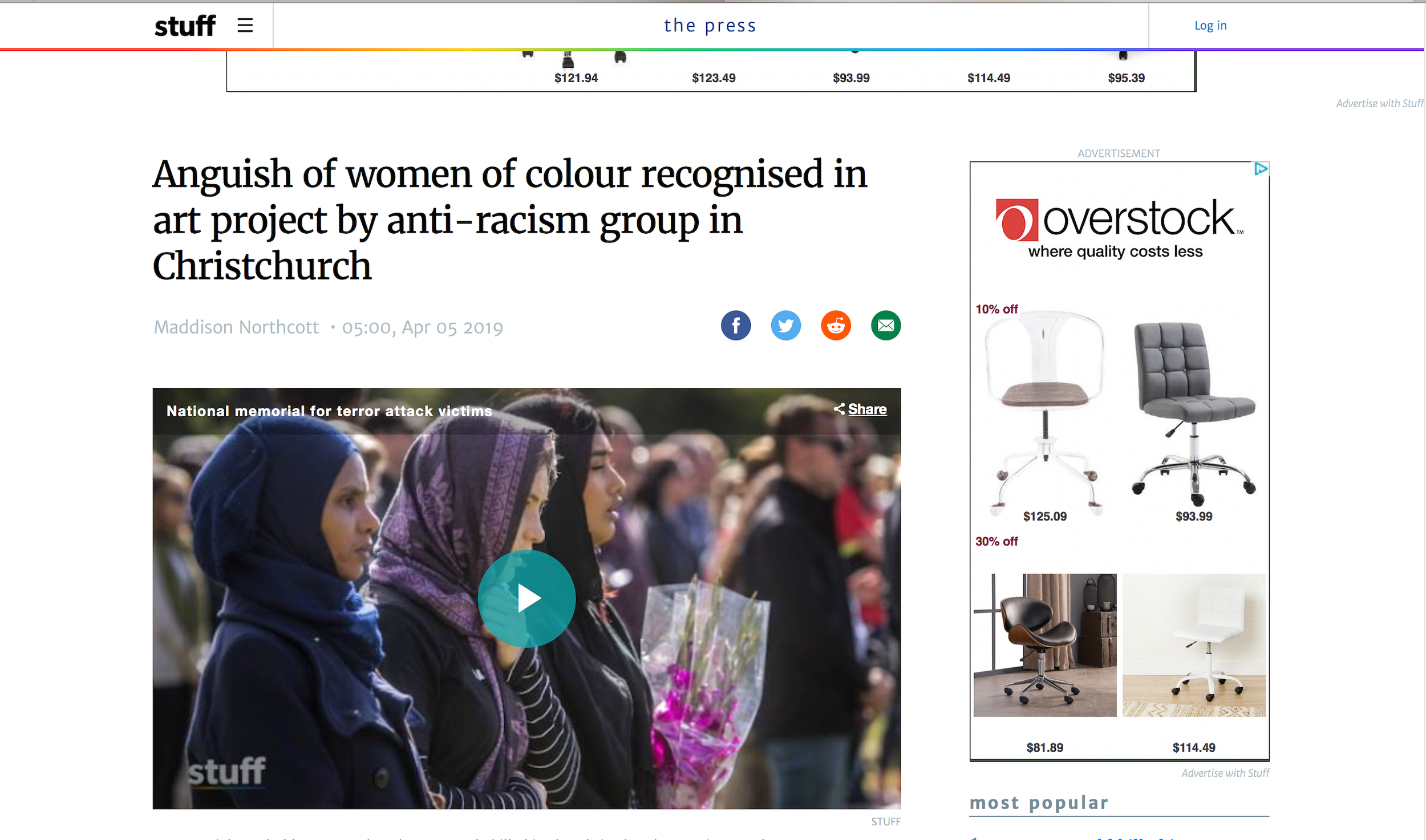 Women of color attending a memorial event, some holding flowers, standing in a crowd.