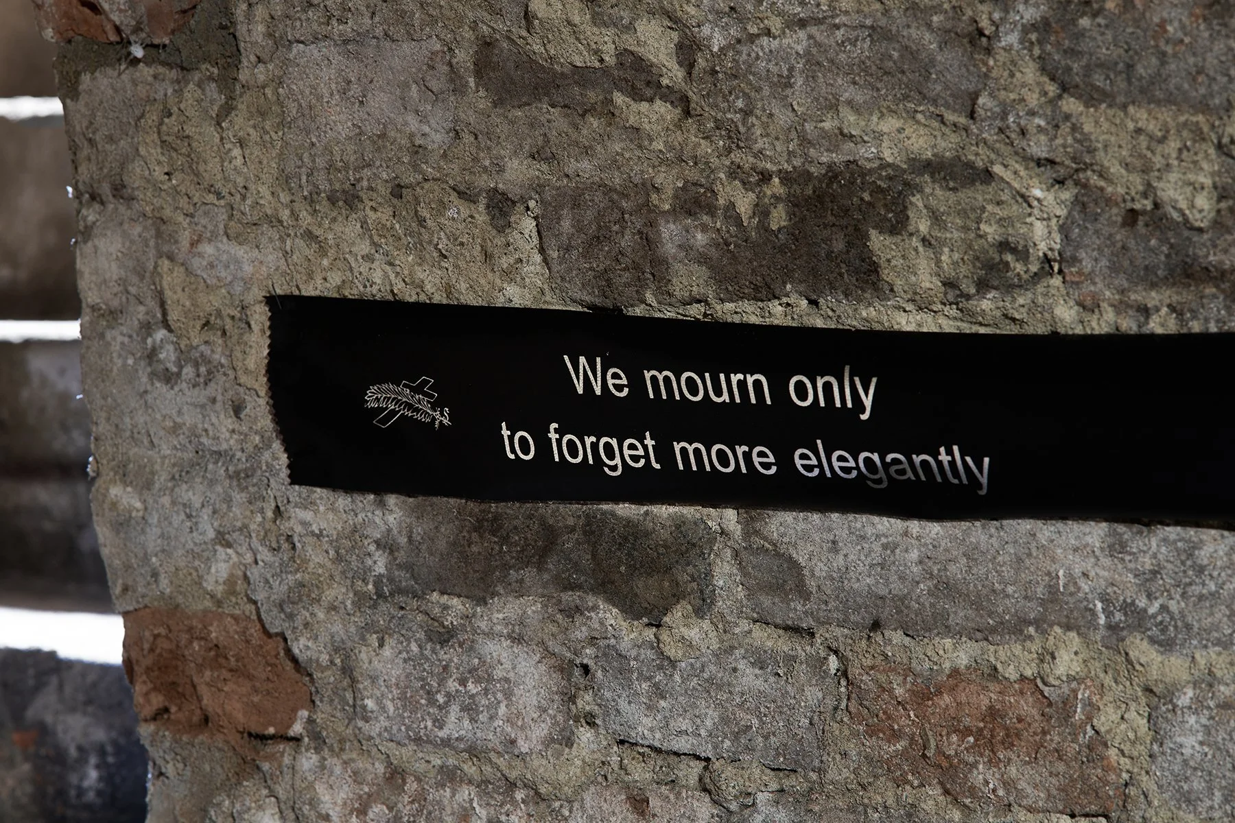 Sofiia Yesakova WE MOURN ONLY TO FORGET MORE ELEGANTLY, 400×15 cm,funeral ribbon, silver paint, 2026