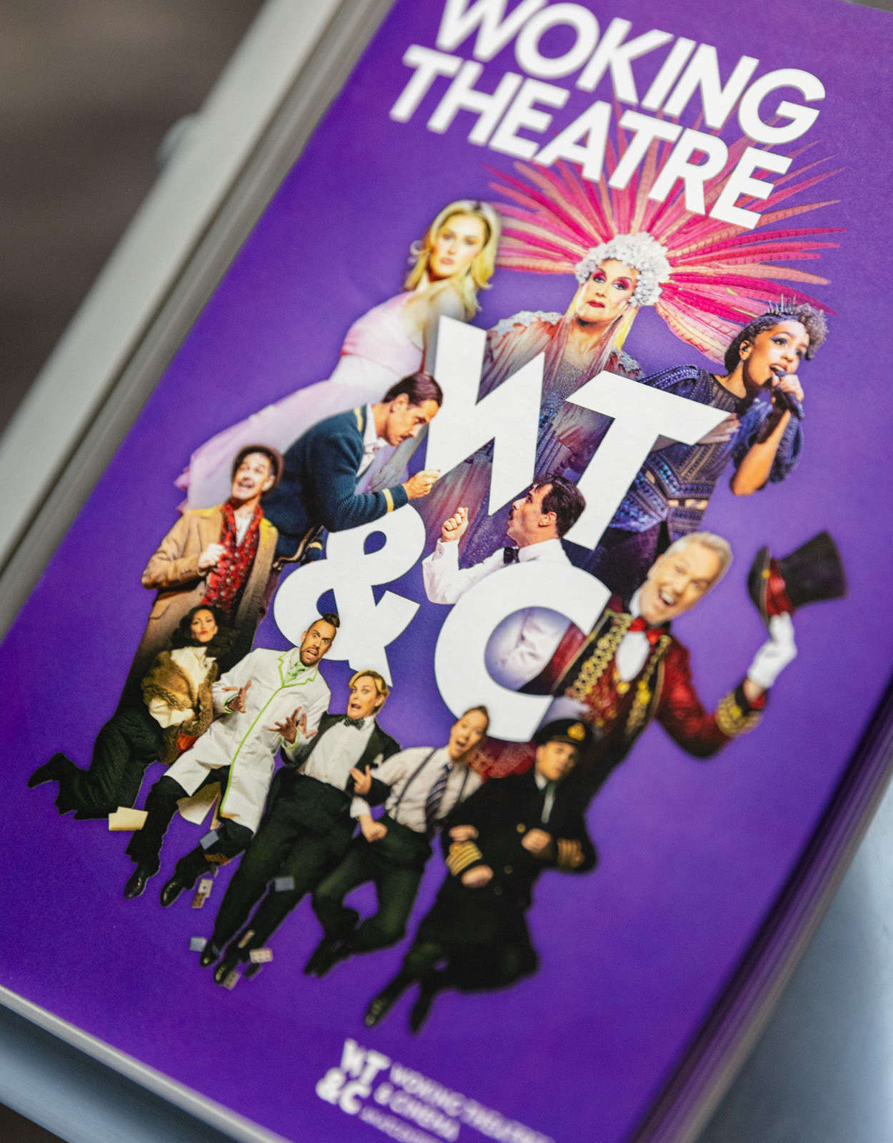 Woking Theatre brochure cover showcasing their new logo design on the front cover