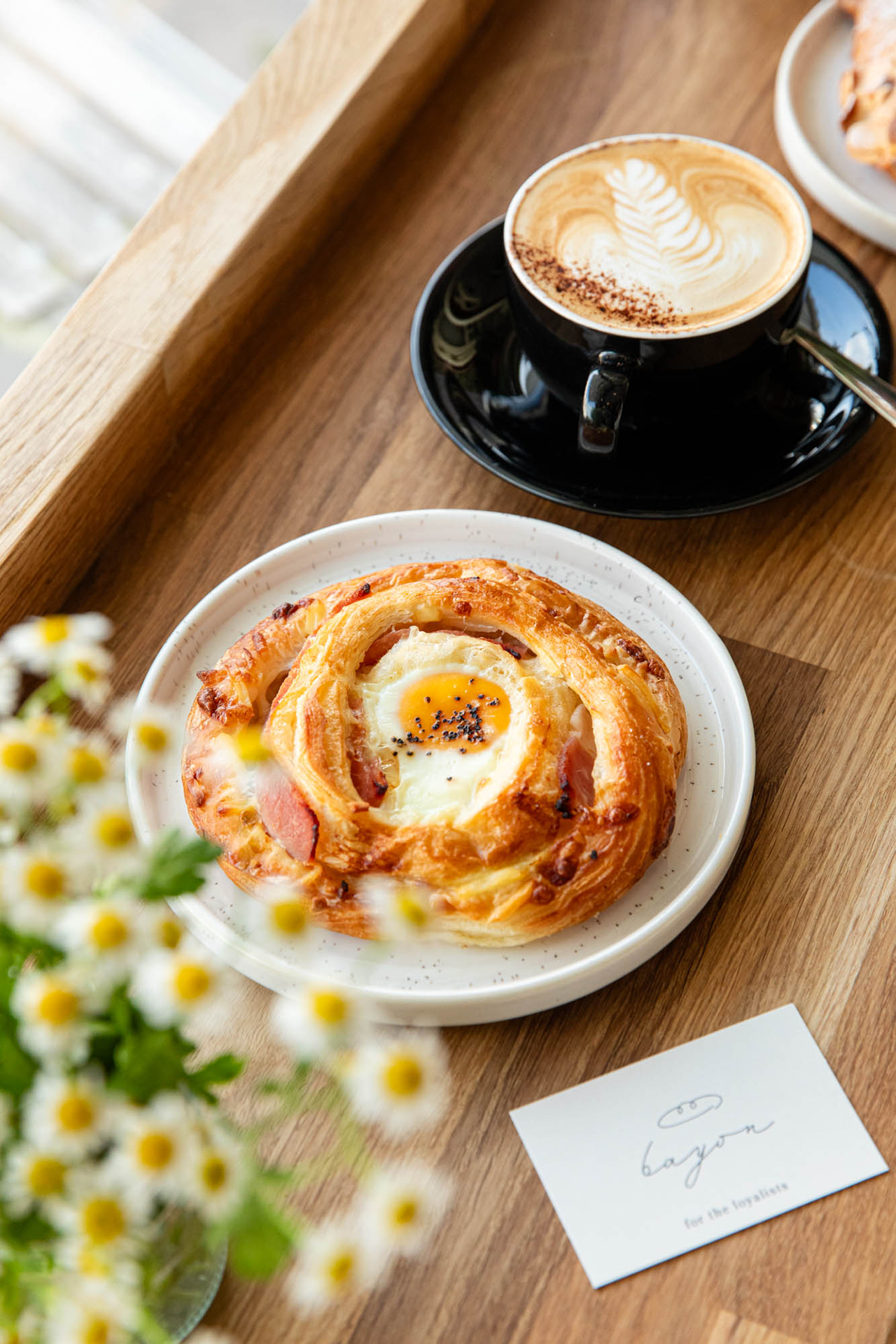 Bayon Bakery business card next to a pastry
