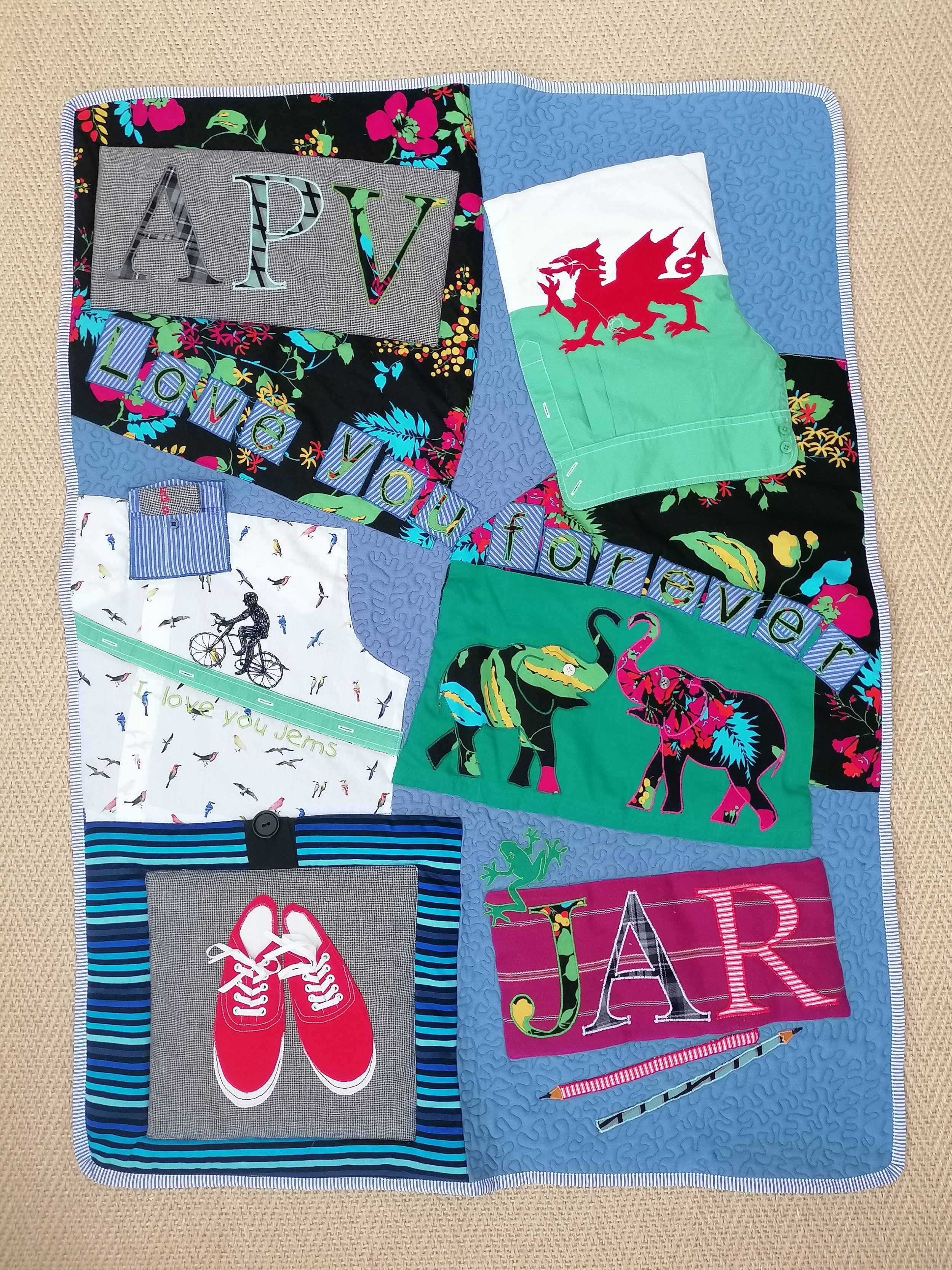 These three quilts were made for three sisters as memory quilts for their parents. Each is made from personal clothing and have matching symbols and images but each has personal elements to each sister and each contains a secret pocket with a persona