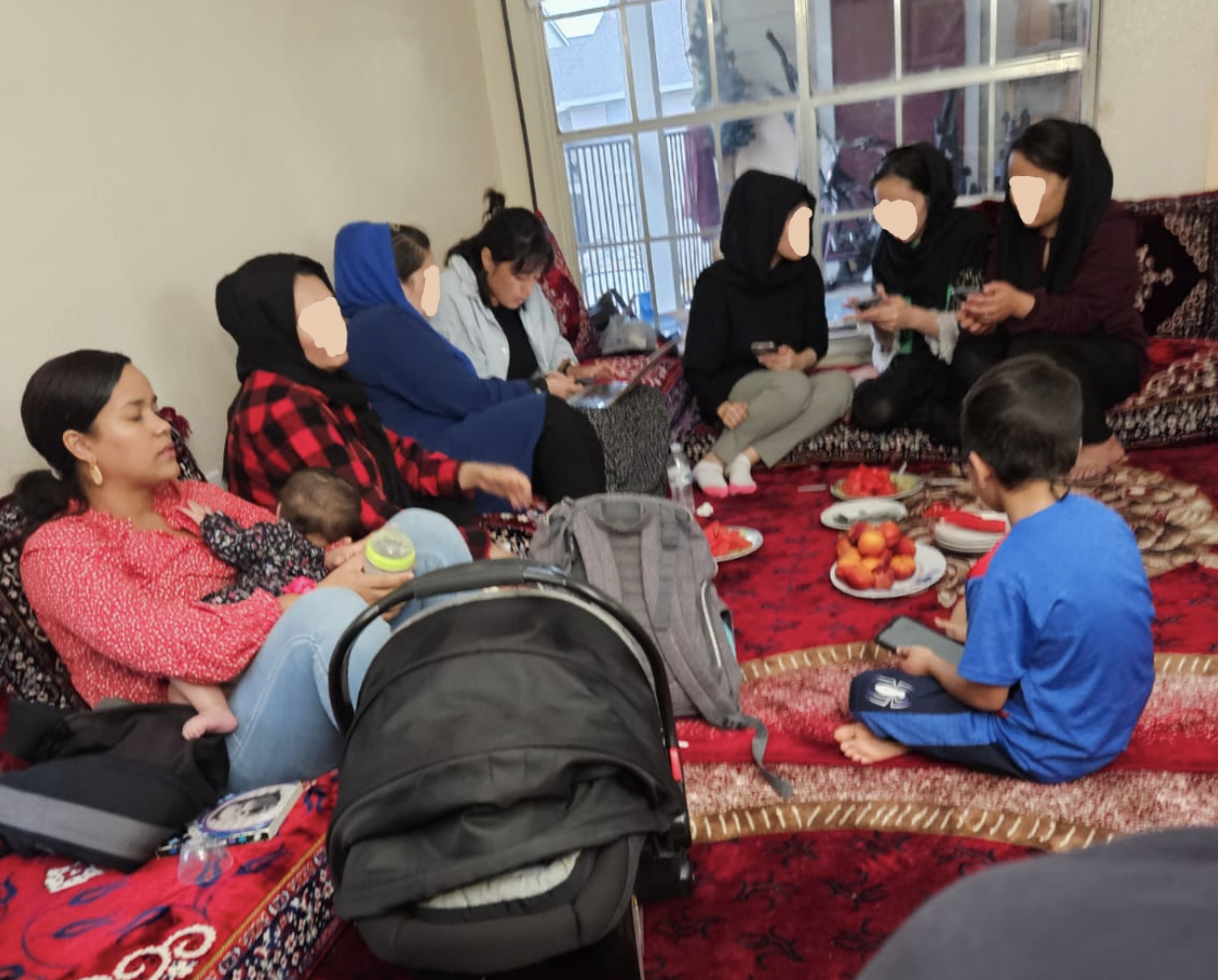 At a home visit with an Afghan family and friends.