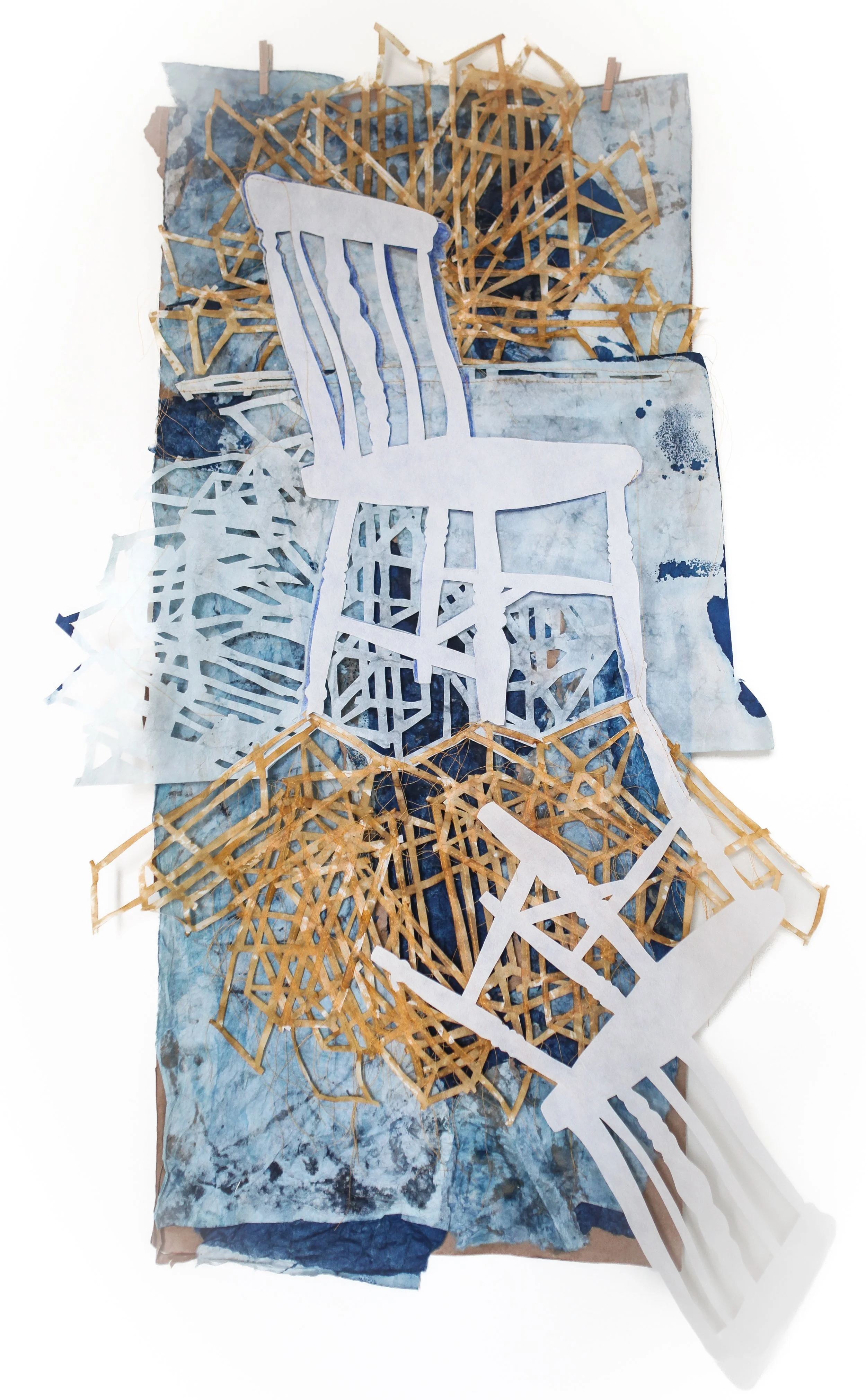 THRONE / 24 x 41" / Cut paper bag with cyanotypes, kozo, shellac, clothespins, and amber thread 