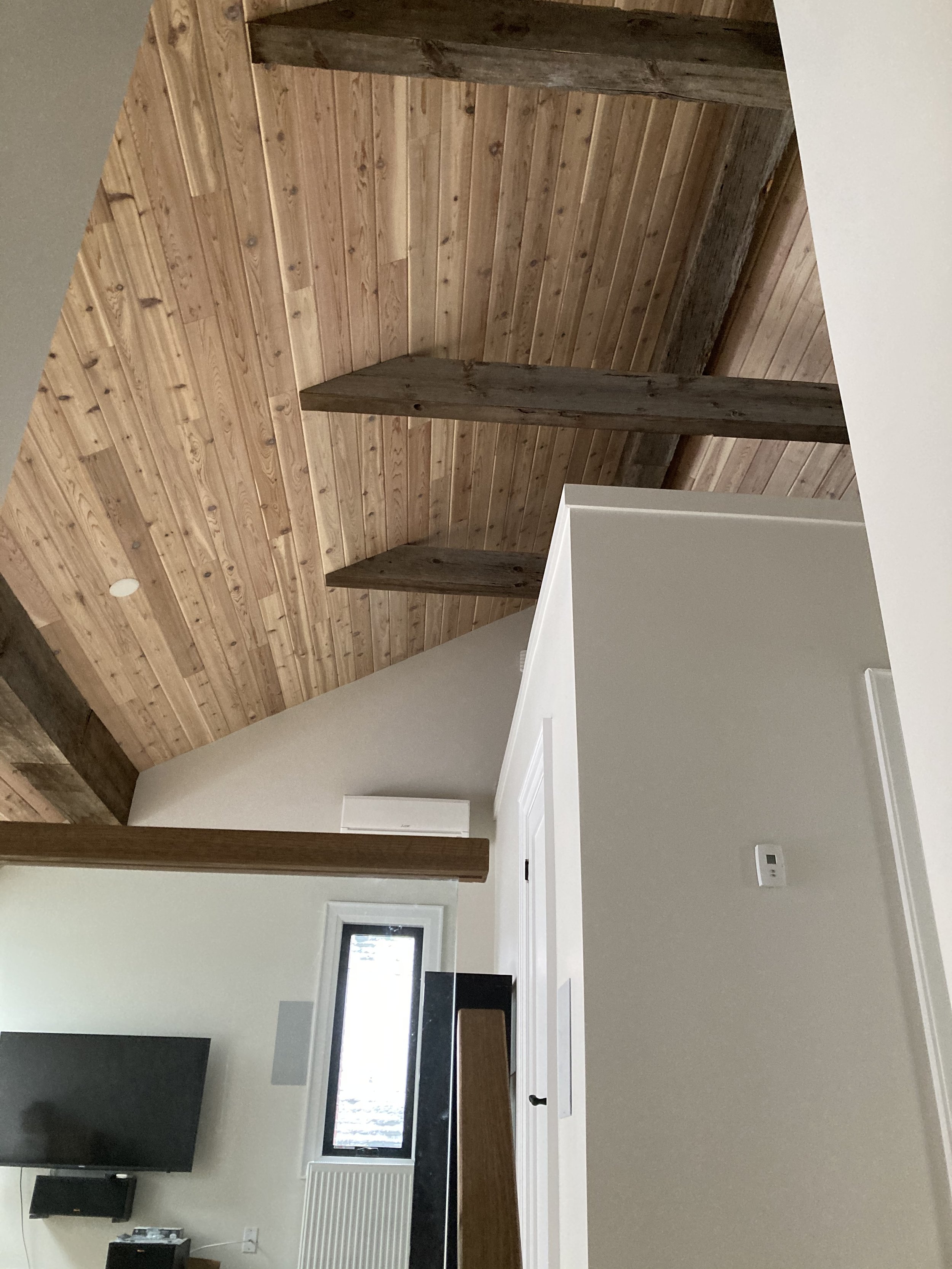 Knotty cedar ceiling with barn board beams