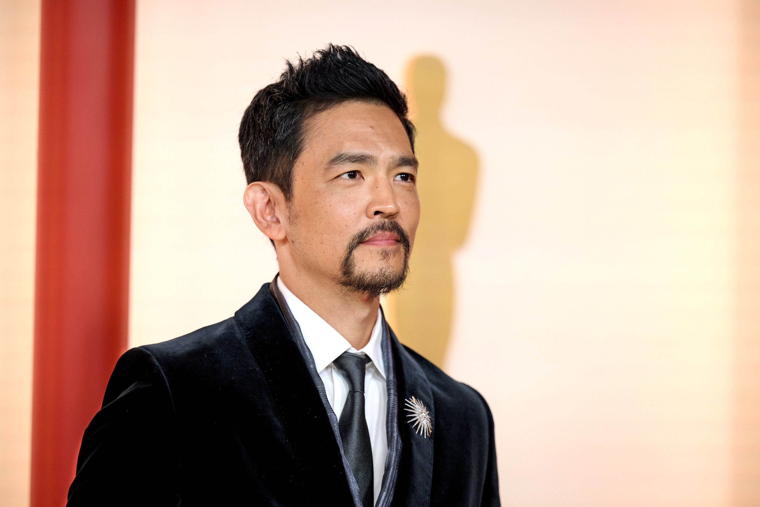 John Cho arrives on the red carpet of The 95th Oscars