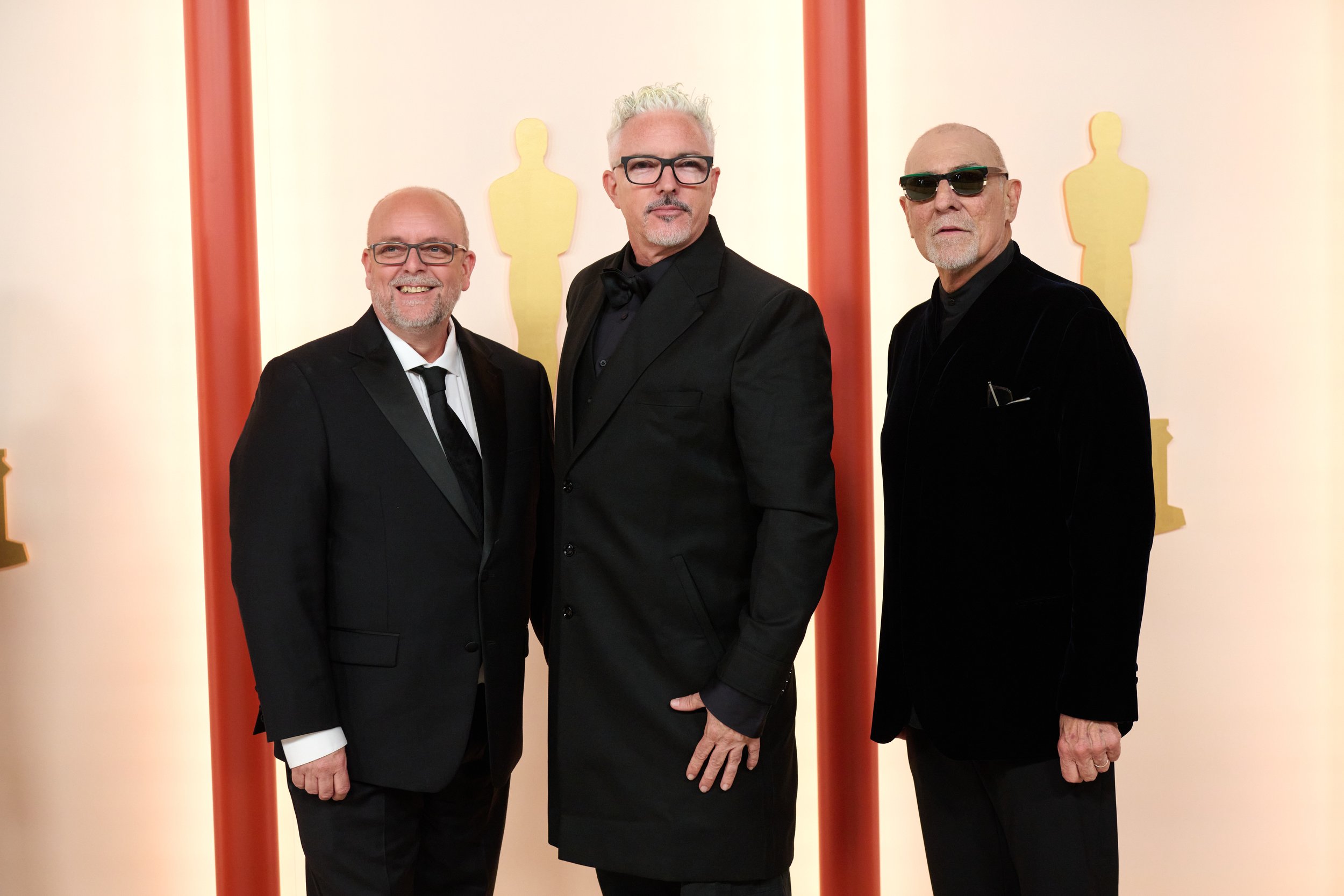 Oscar® nominees Mark Coulier, Jason Baird and Aldo Signoretti (L-R) arrive on the red carpet of the 95th Oscars