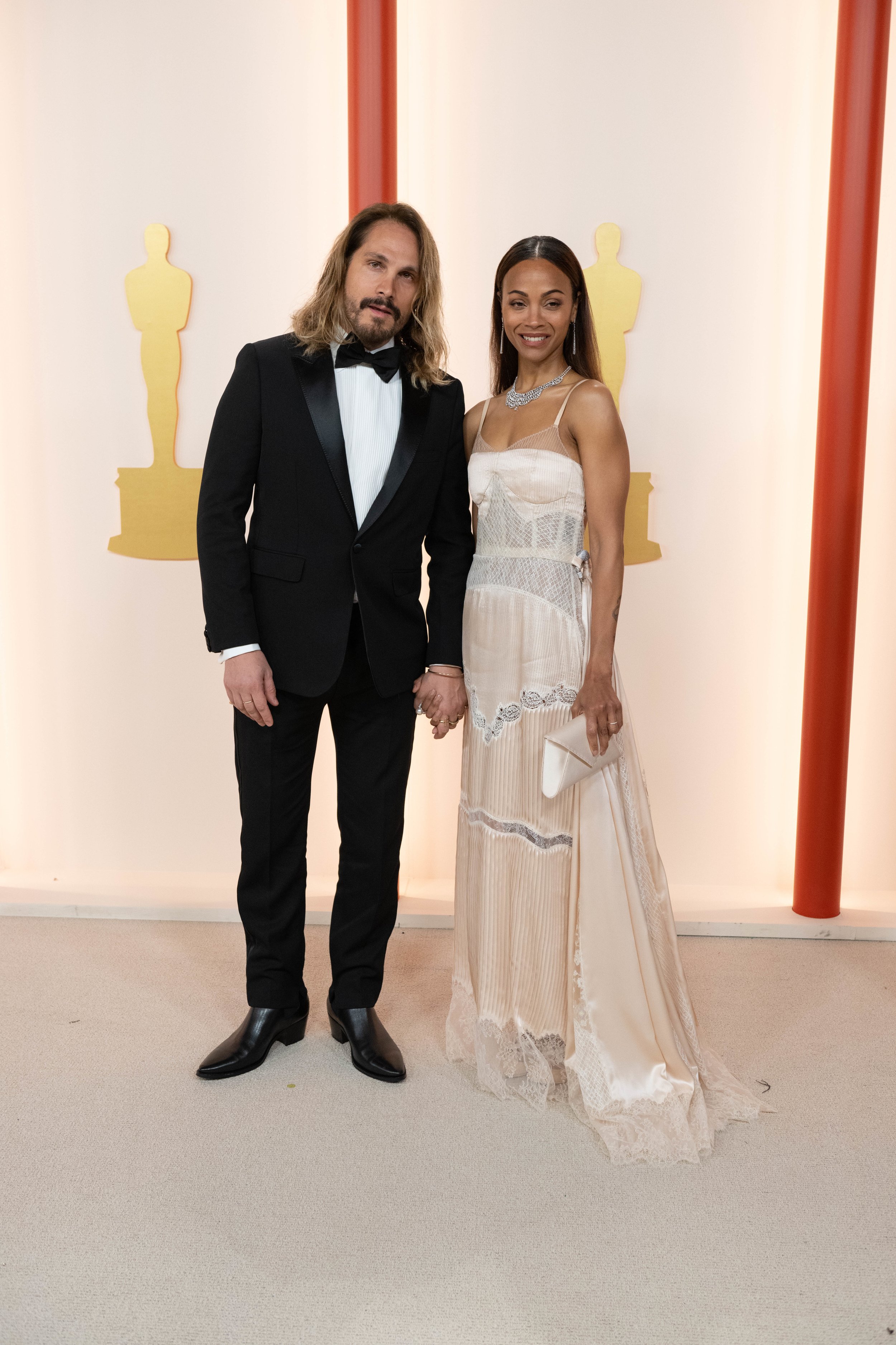 Marco Perego Saldana and Zoe Saldana arrive on the red carpet of The 95th Oscars® at the Dolby