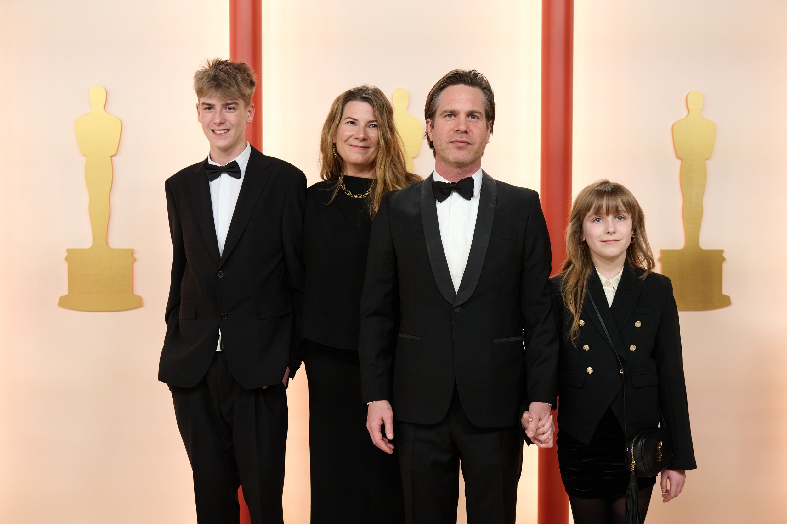 Oscar® nominee Mikkel Nielsen arrives with guests on the red carpet of The 95th Oscars