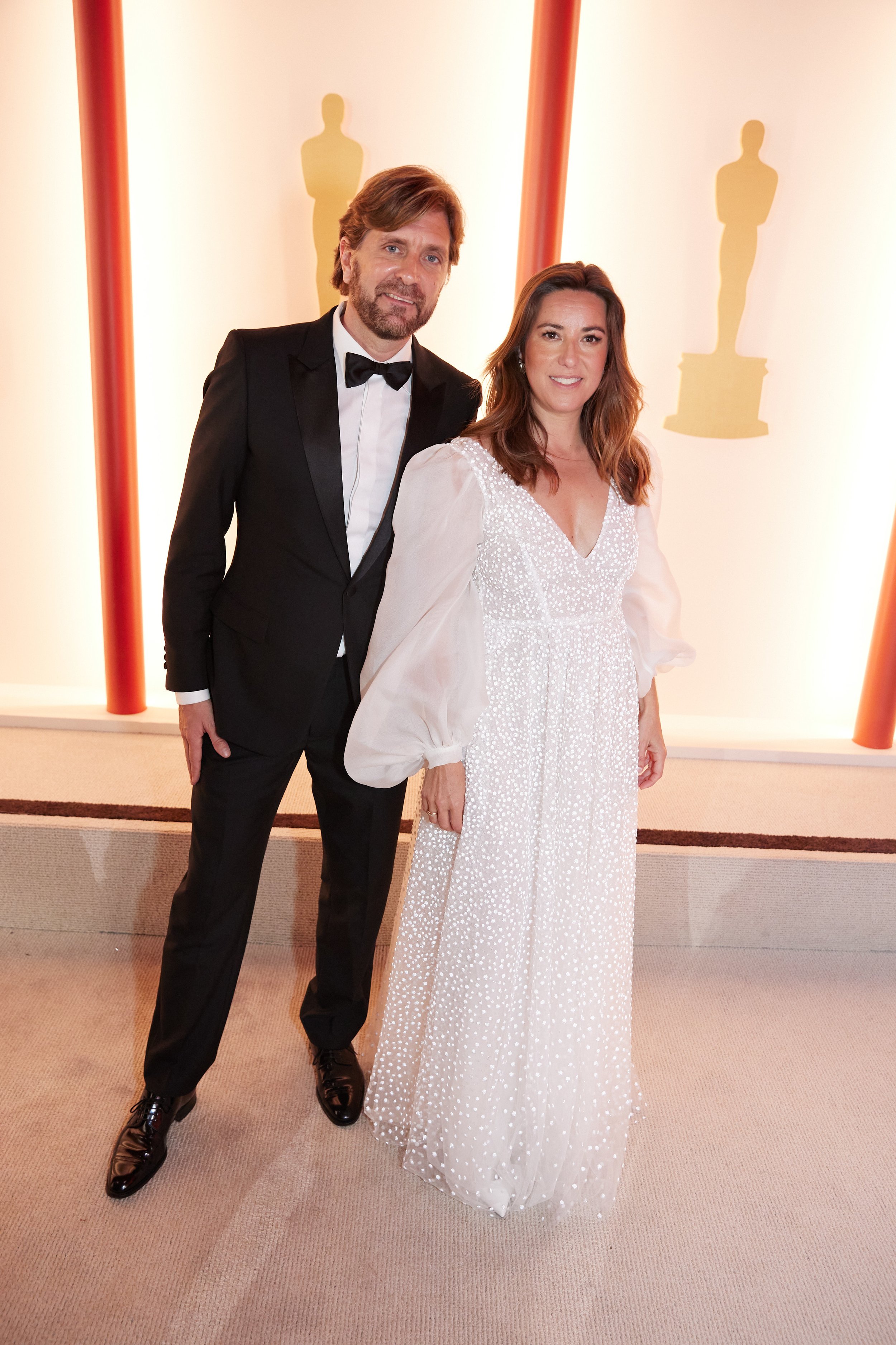 Oscar® nominee Ruben Östlund arrives with guest on the red carpet of The 95th Oscars® at the Dolby