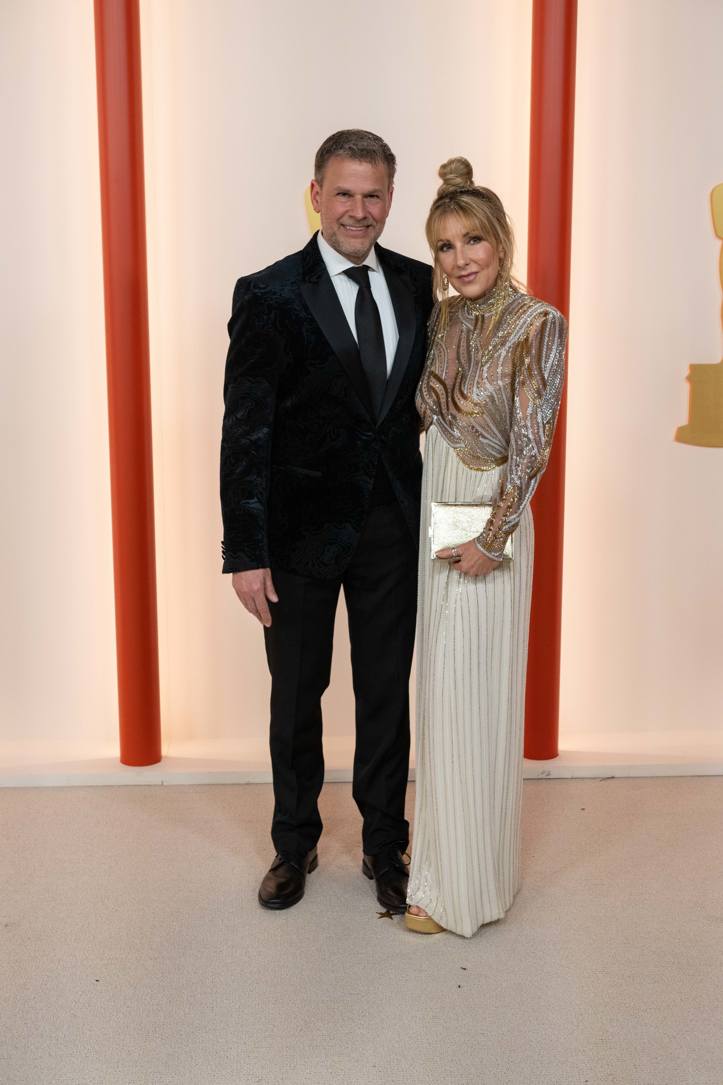 Oscar® nominee Joel Harlow and guest arrive on the red carpet of the 95th Oscars