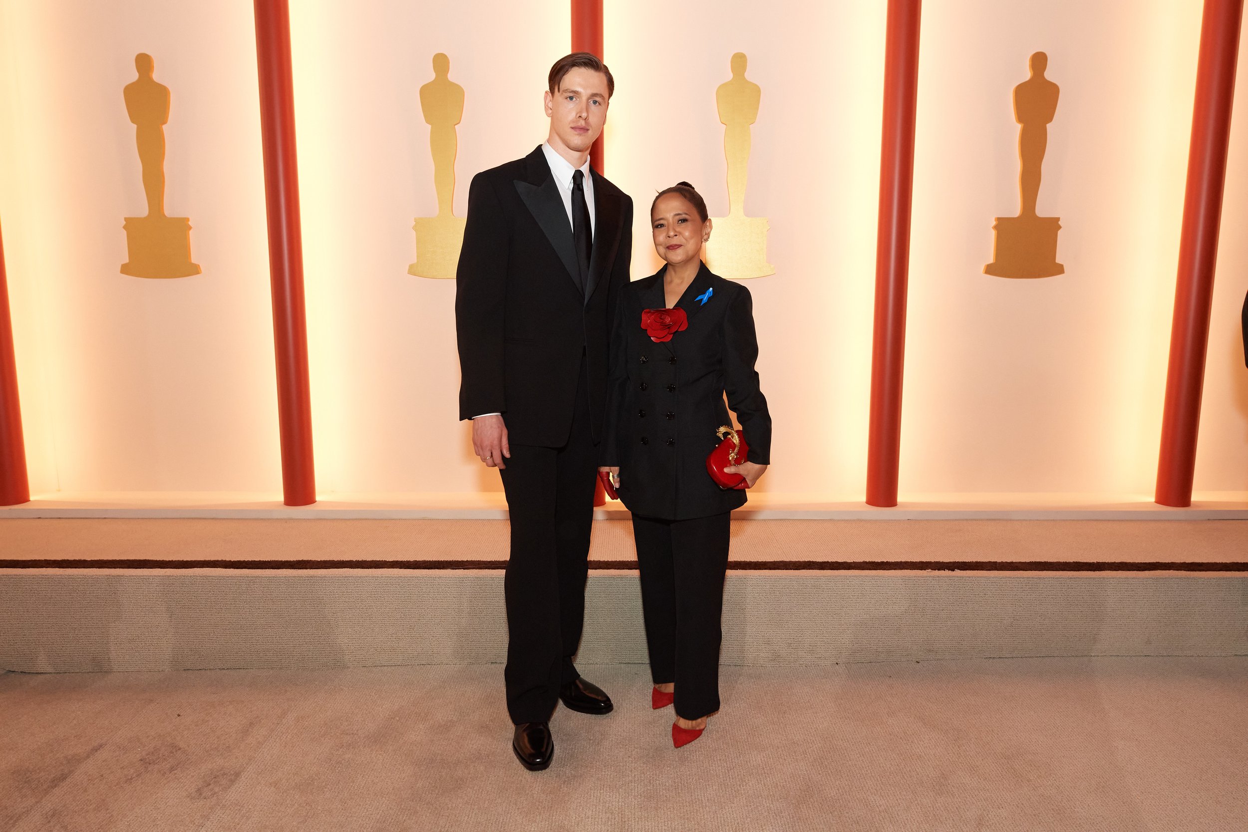 Harris Dickinson and Dolly De Leon arrive on the red carpet of The 95th Oscars