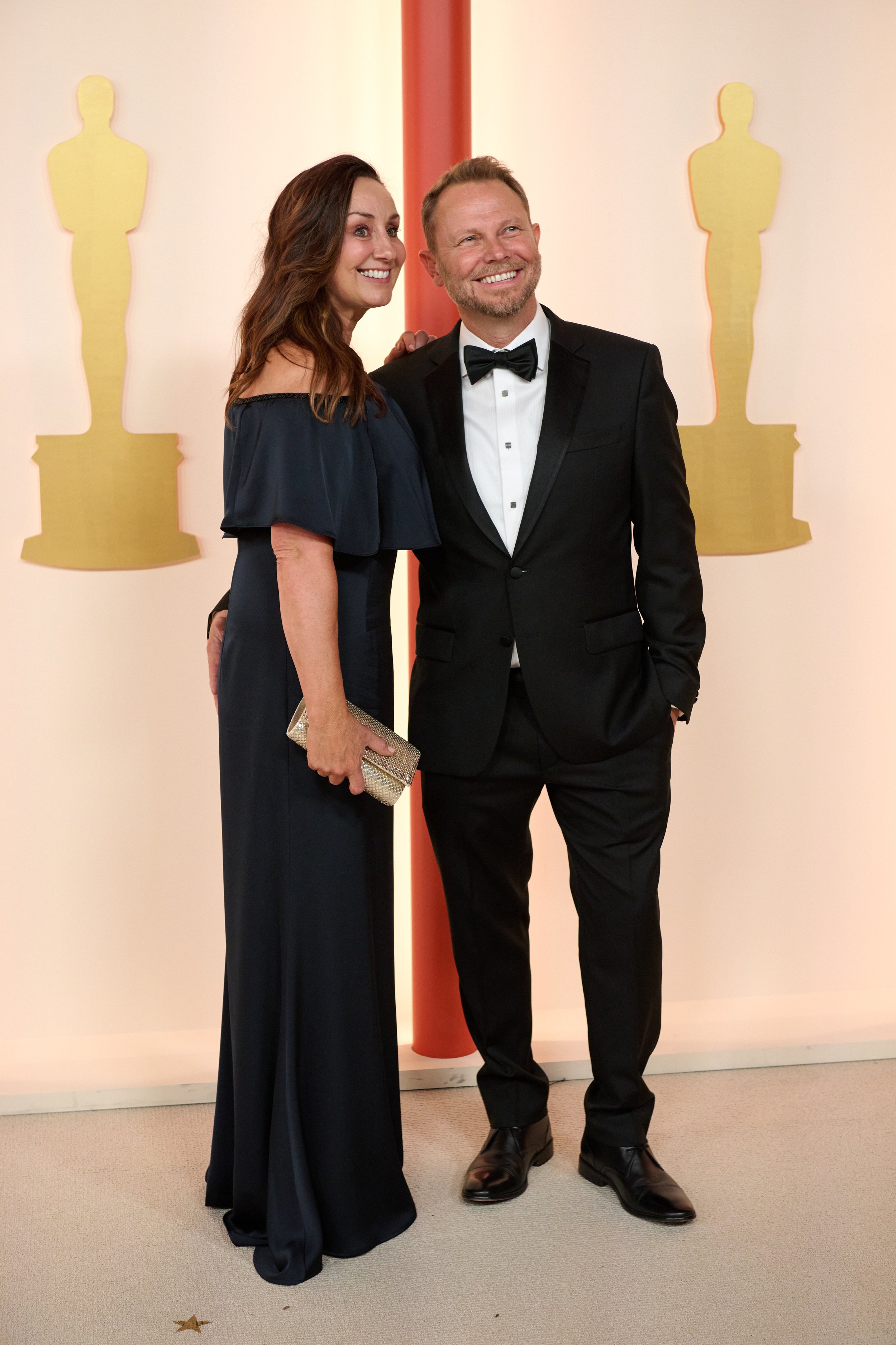 Oscar® nominee Richard Baneham arrives with a guest on the red carpet of the 95th Oscars