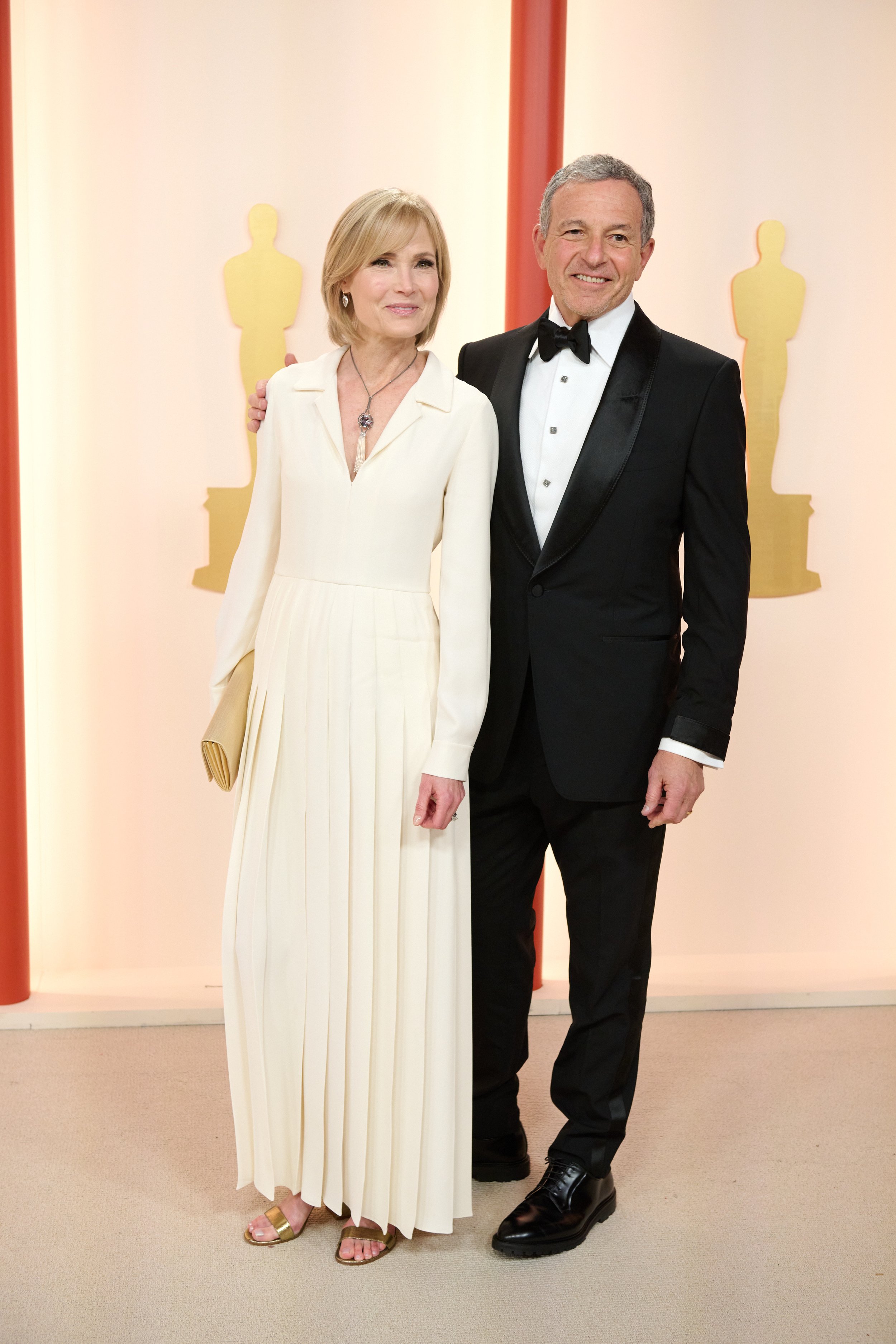 Willow Bay and Bob Iger arrive on the red carpet of The 95th Oscars