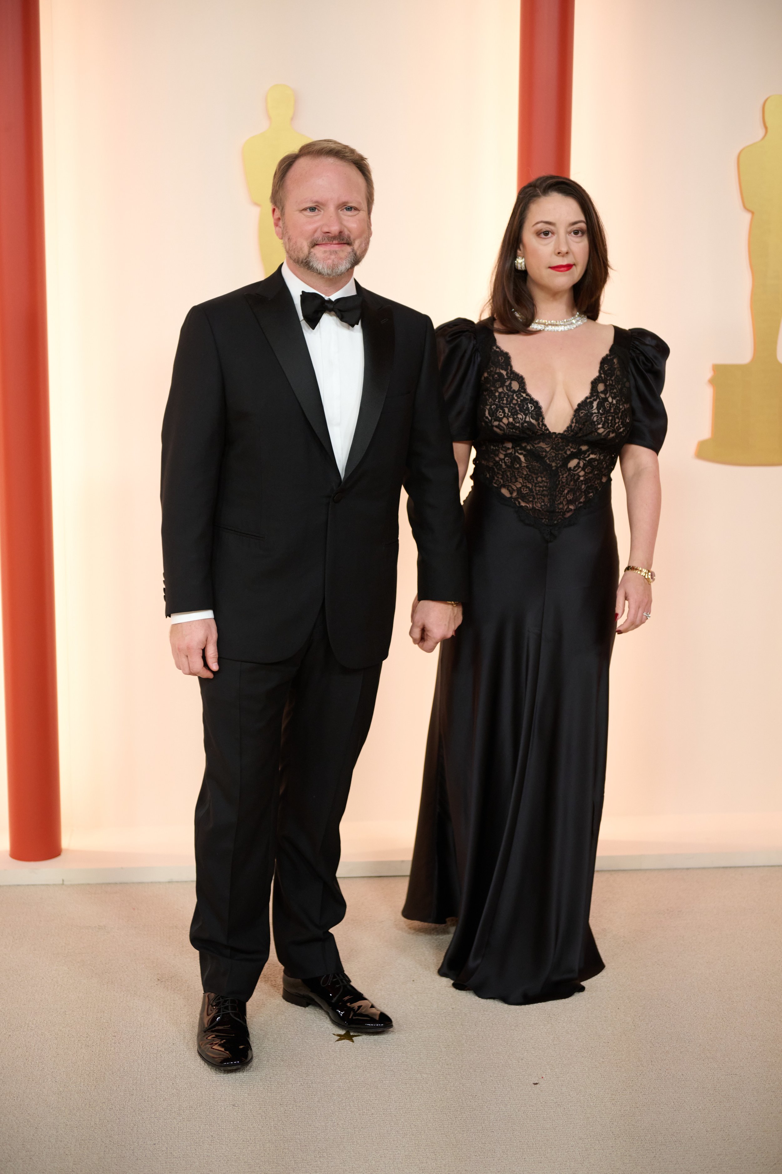 Oscar® nominee Rian Johnson and Karina Longworth arrive on the red carpet of the 95th Oscars