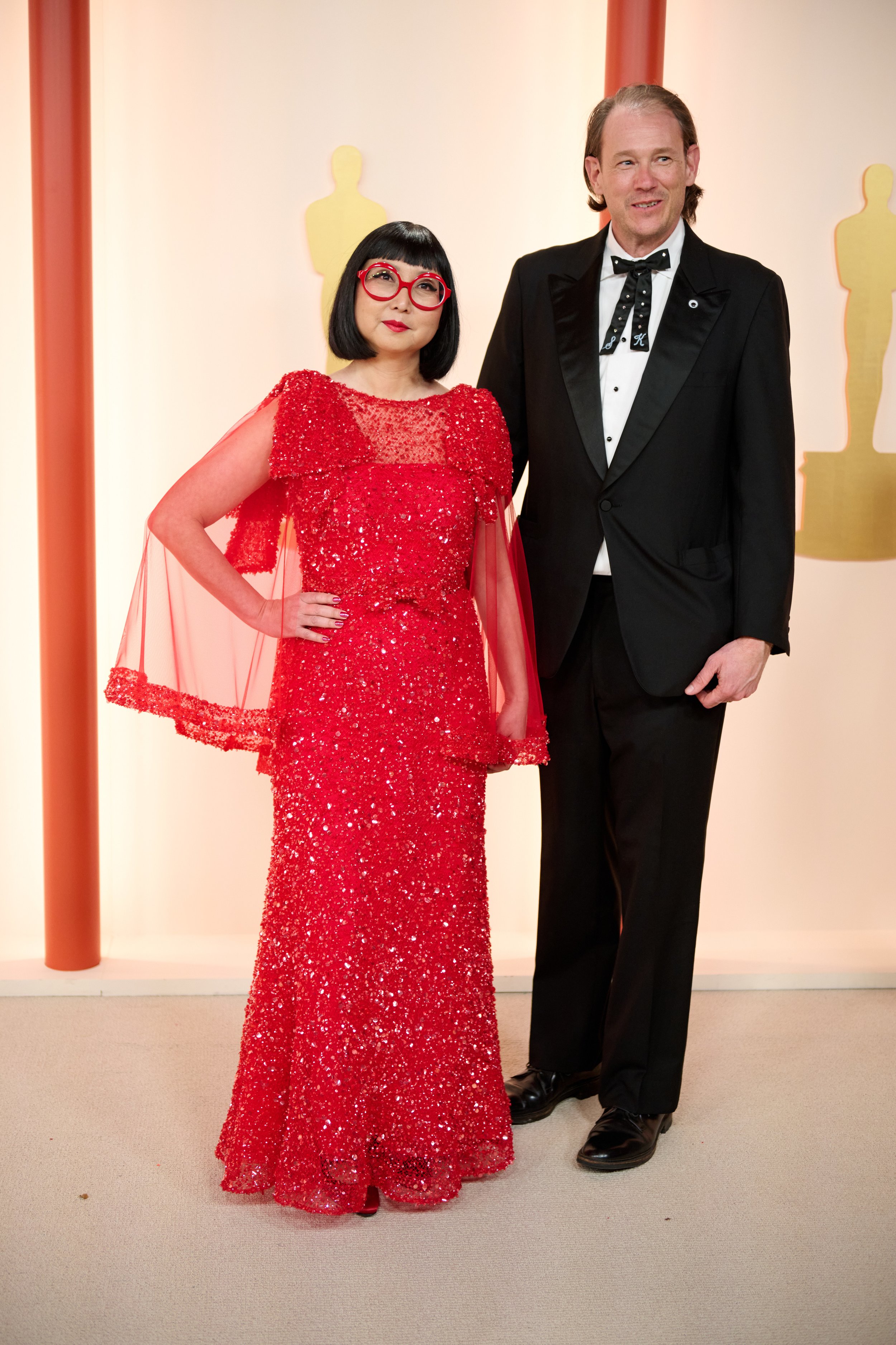Oscar® nominee Shirley Kurata arrives with Charles Staunton on the red carpet of The 95th Oscars