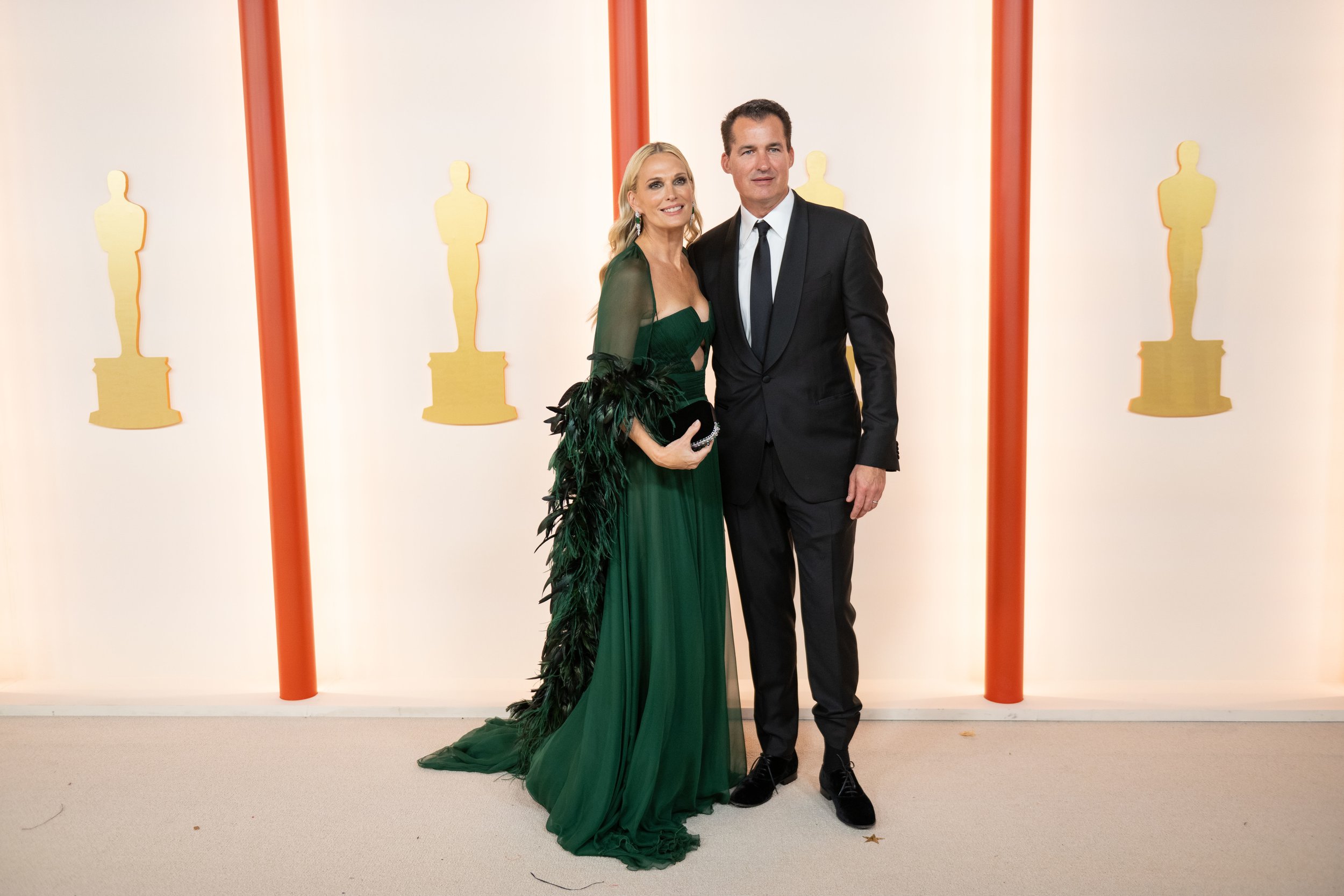 Molly Sims and guest arrive on the red carpet of the 95th Oscars