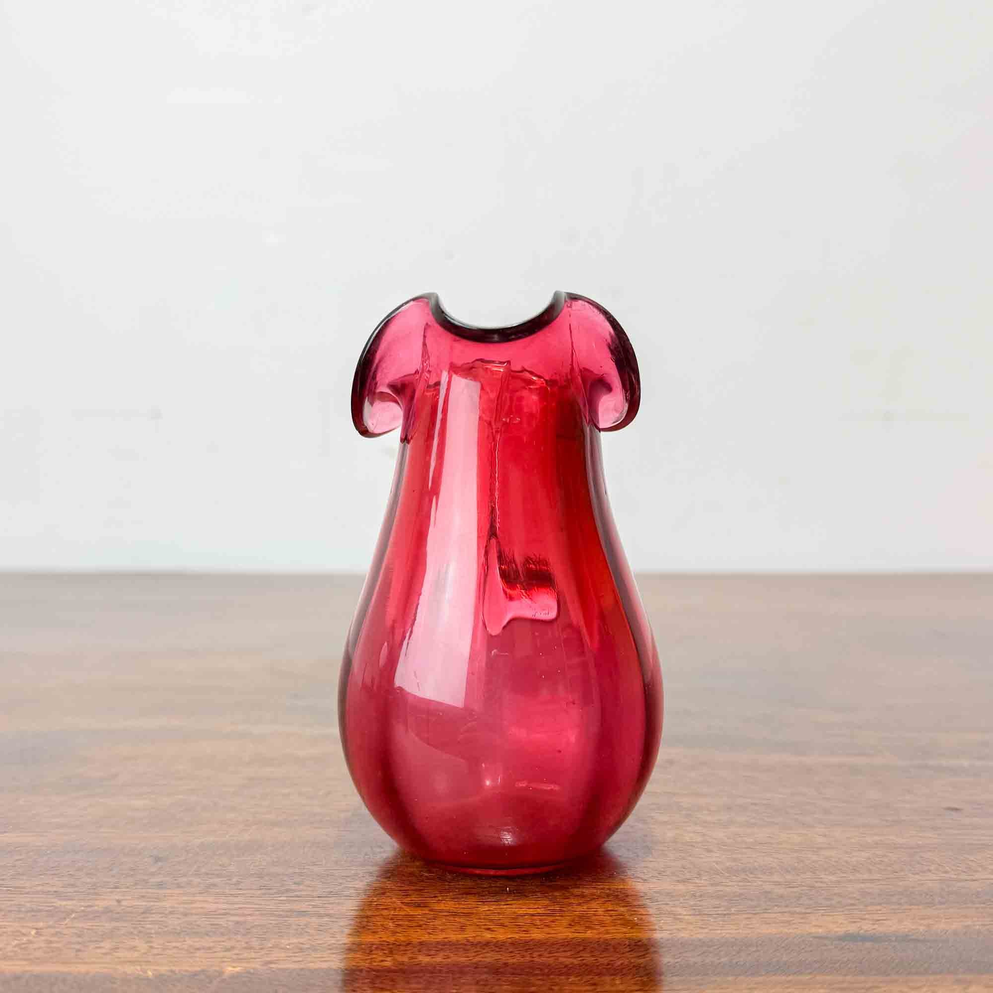 small antique cranberry glass jug
