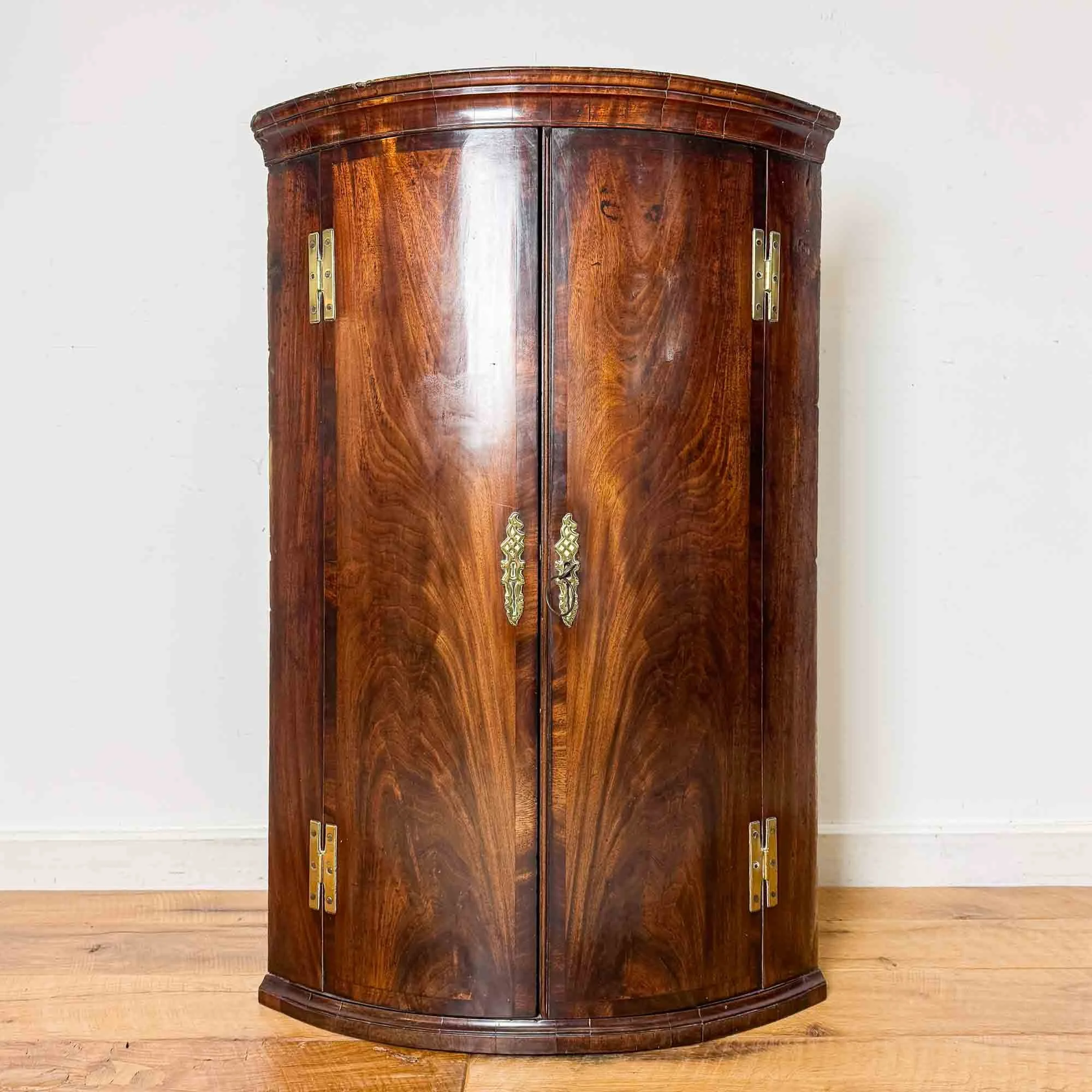 Georgian Flame Mahogany Bow Front Corner Cupboard