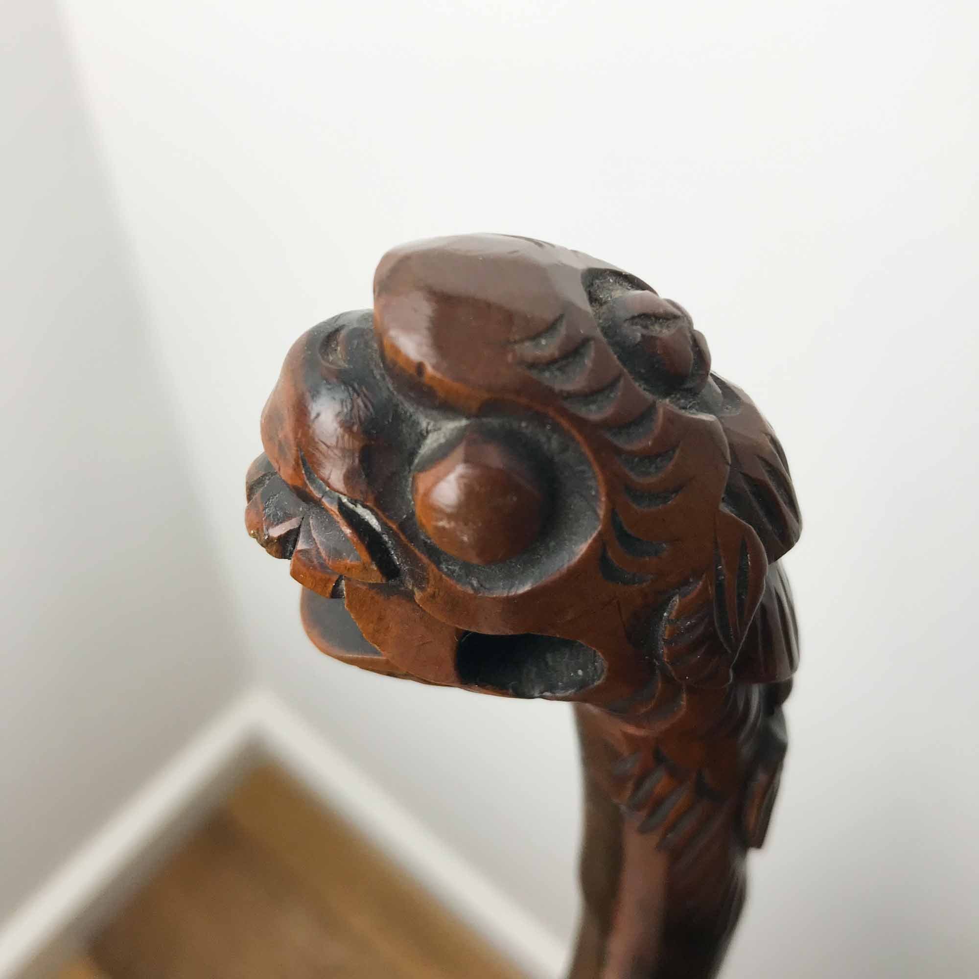 walking stick dragon with ball in mouth