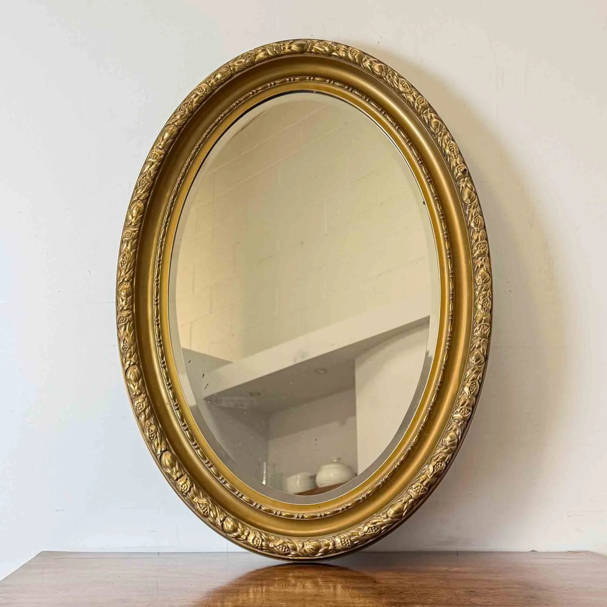 antique oval gilt mirror