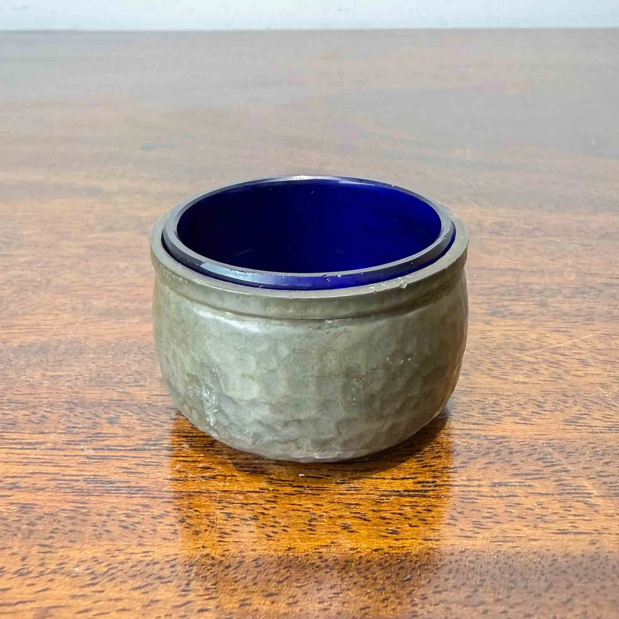 Lion hammered pewter salt with bristol blue glass liner.jpg