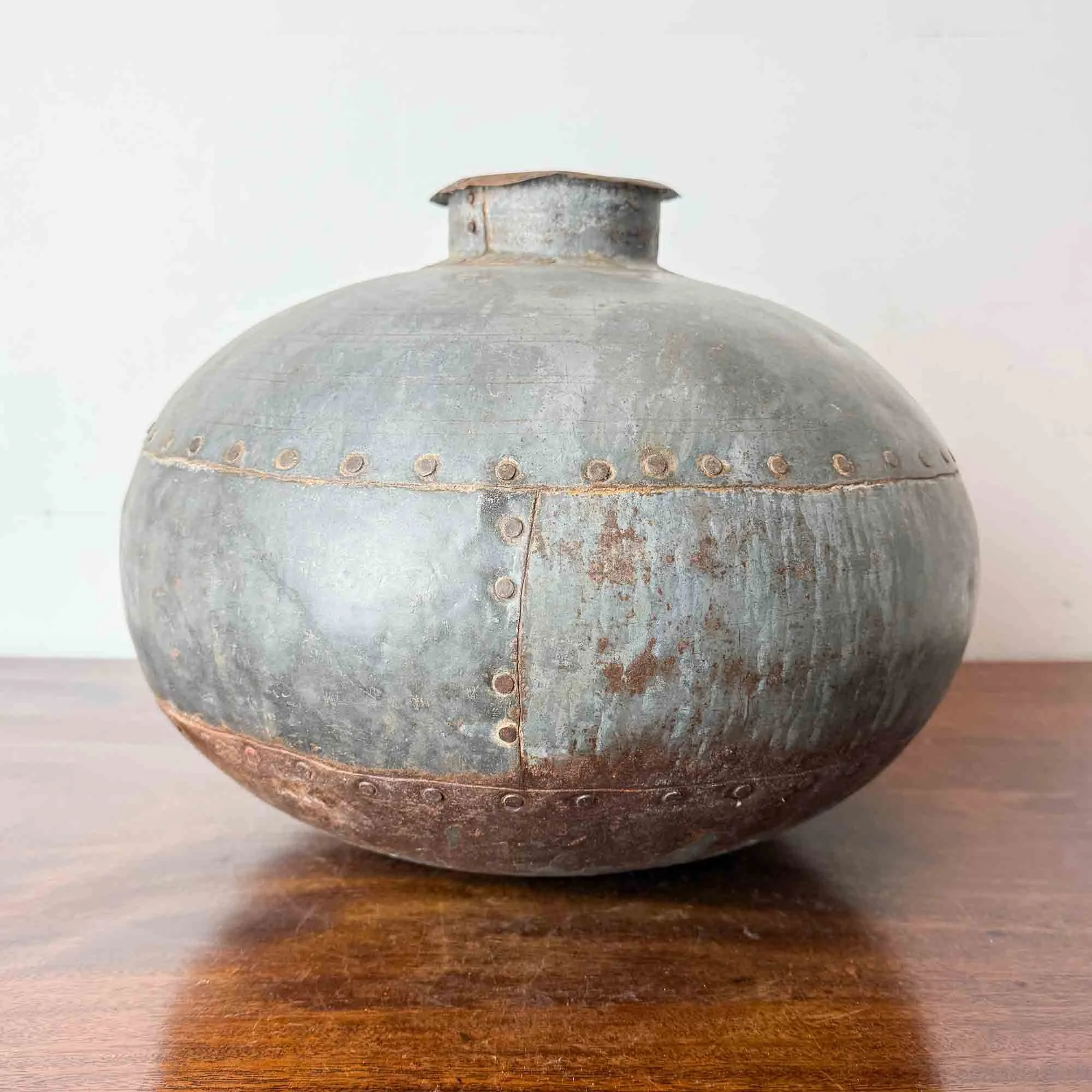 vintage riveted metal water pot