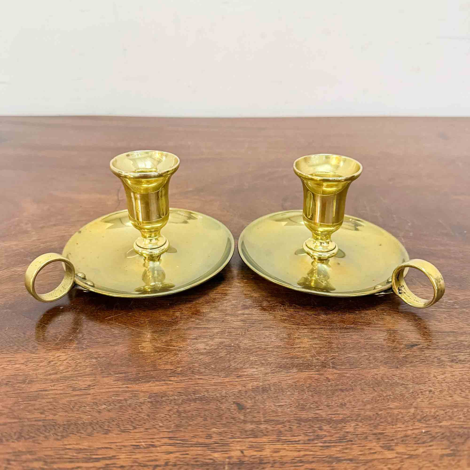 pair of antique brass chamberstick candle holders