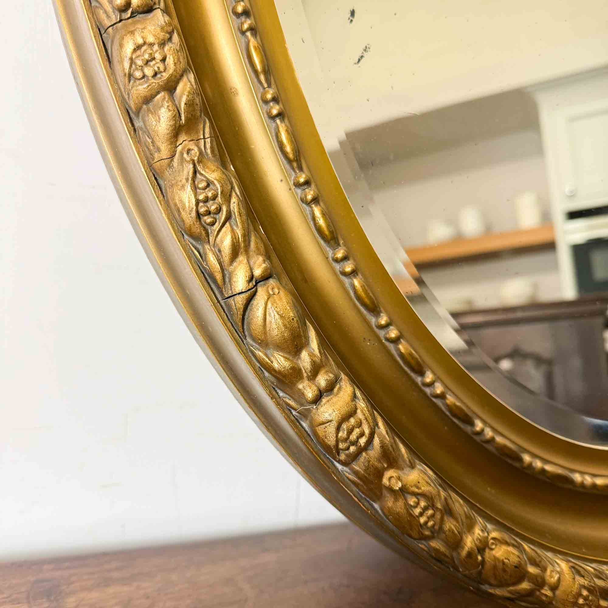 19th century oval gilt mirror