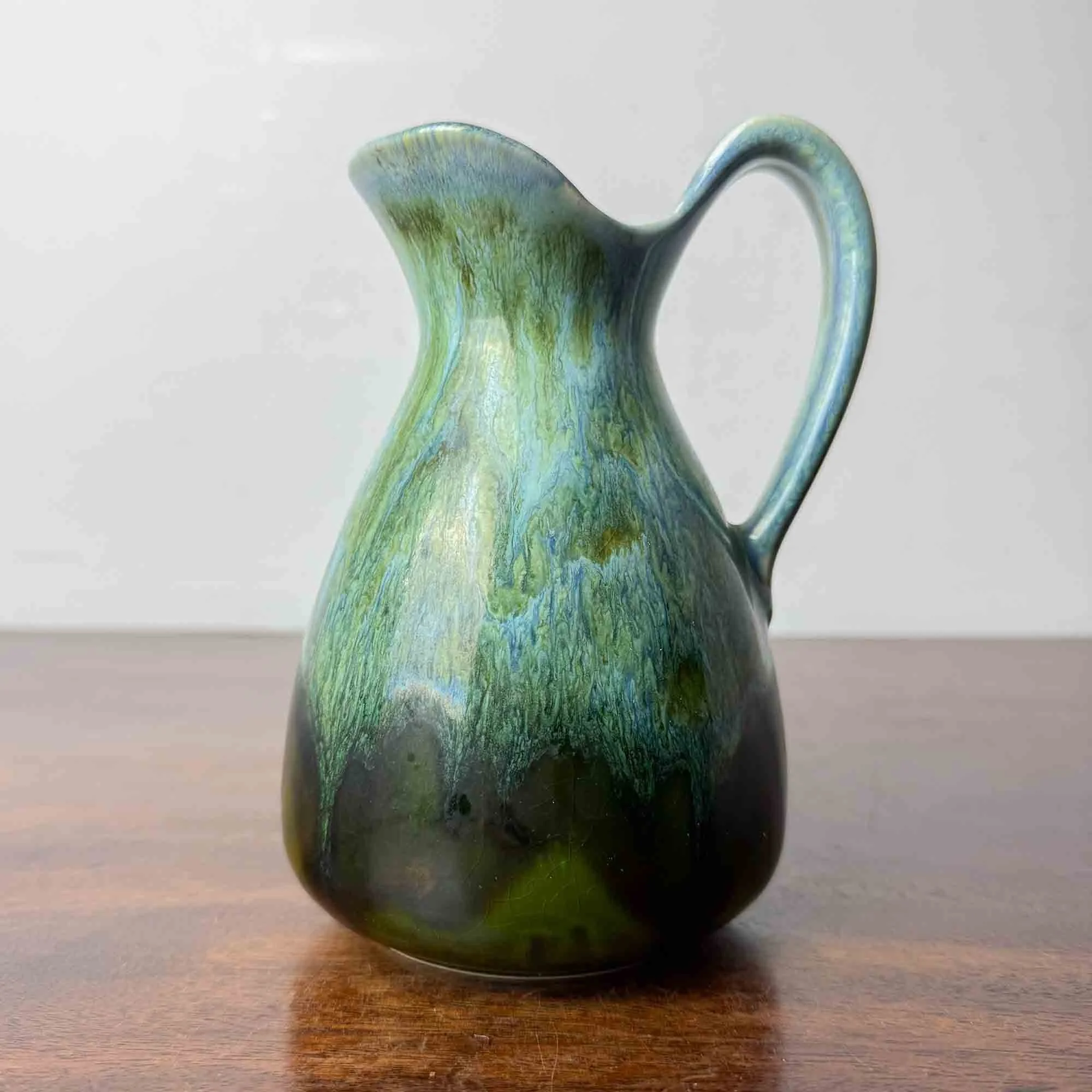 green turquoise lava glaze jug