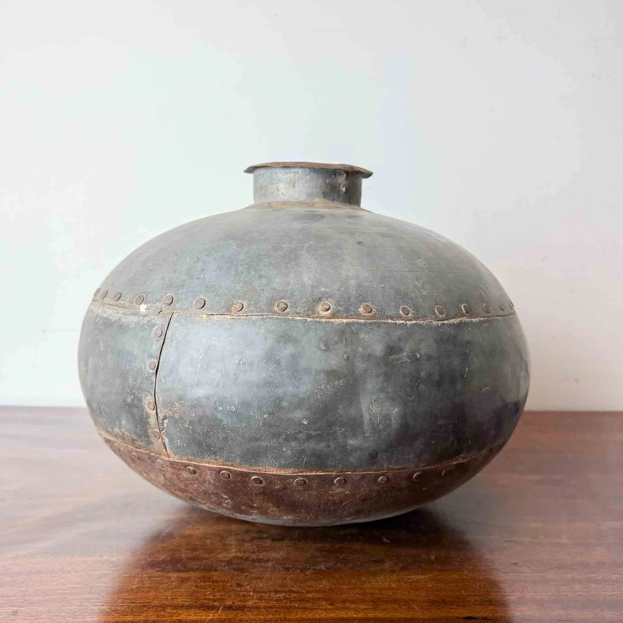 Indian riveted metal water pot