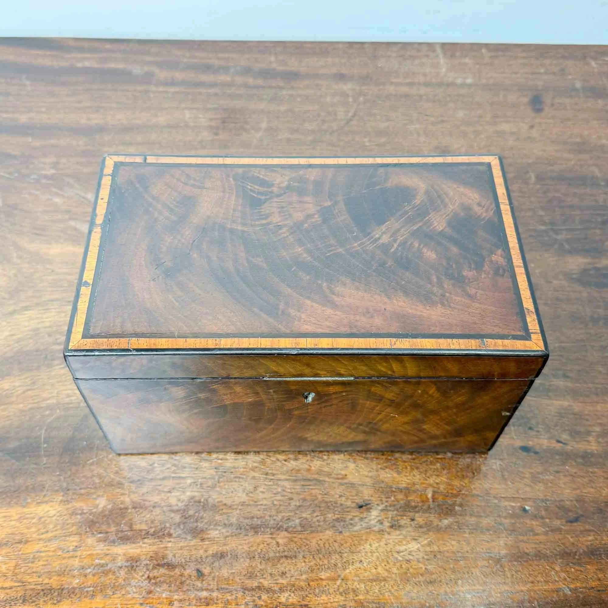antique flame mahogany tea caddy