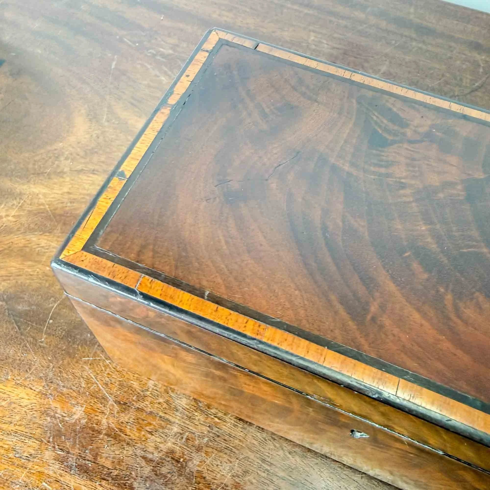antique flame mahogany and ebony tea caddy
