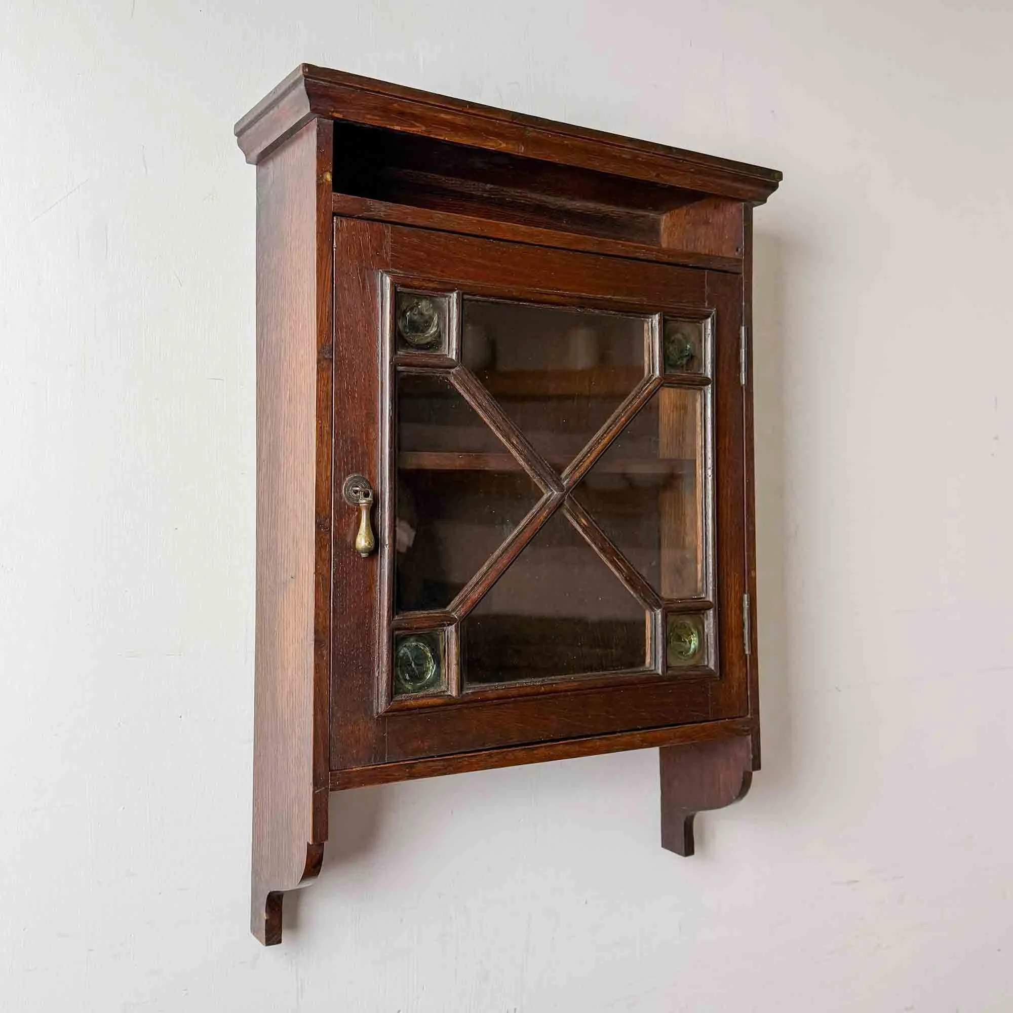 antique oak arts and crafts wall cabinet with glazed door