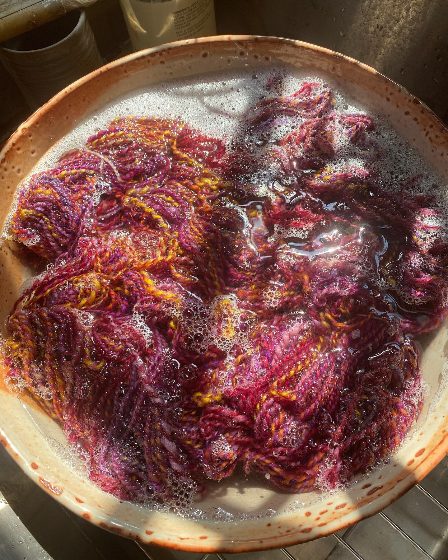 Yarn bath. After plying my hand-spun yarn, I give the skein a bath in a few drops of finer wash. This &ldquo;fulls&rdquo; the yarn and draws out any residual dye in the fiber. I rinse with lukewarm water and gently squeeze before hanging to dry. 
#ya