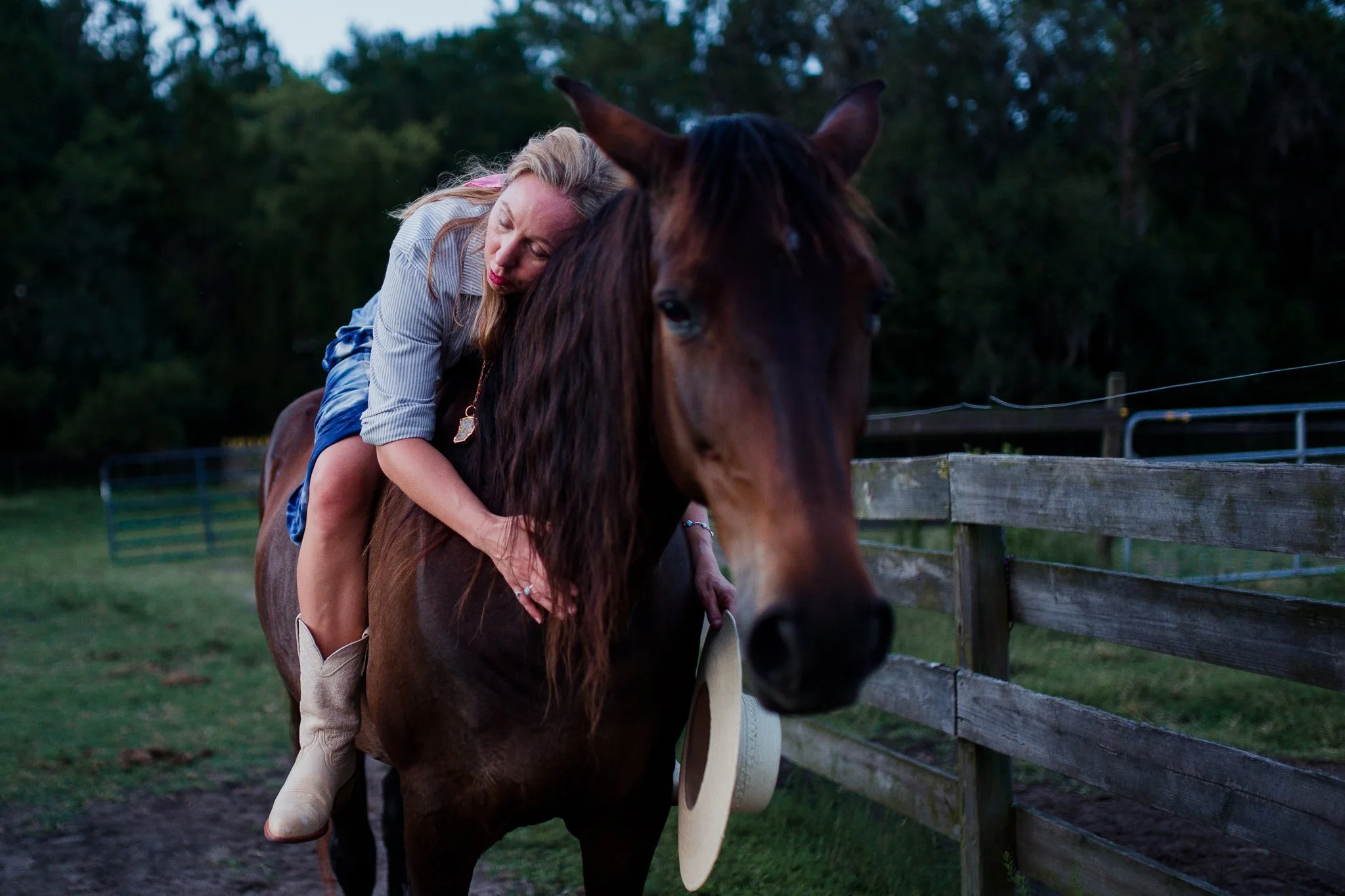 Woman and horse at sunset