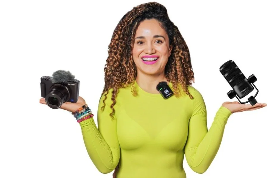 Person holding a camera and a microphone