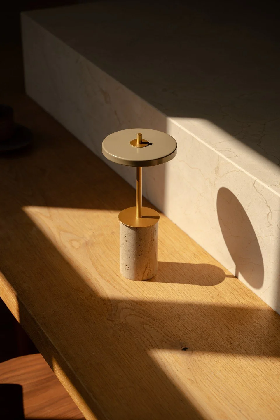 UMAGE_lifestyle_Asteria Move Mini_travertine_brass_(2).jpg