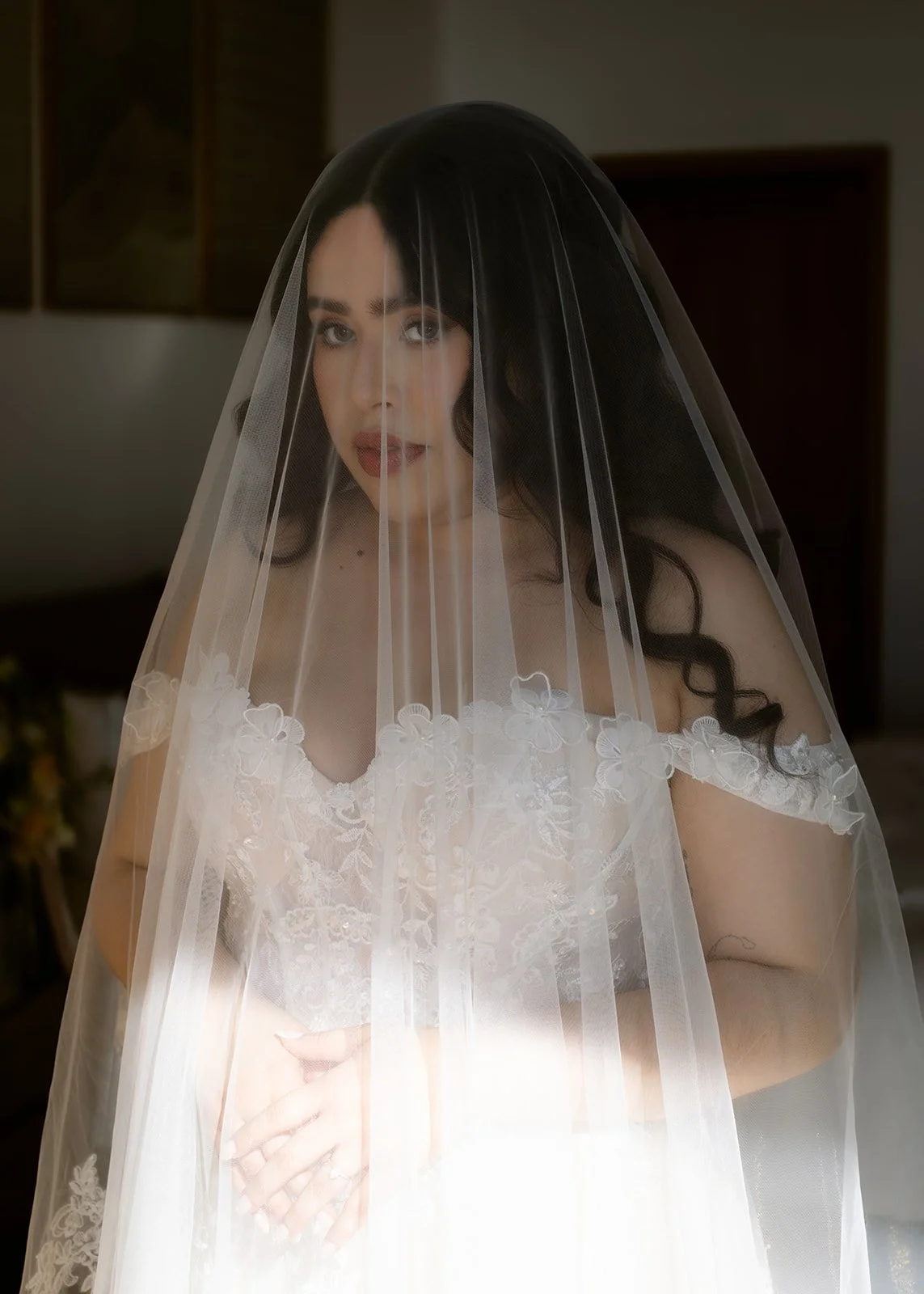 Woman in wedding dress and veil.