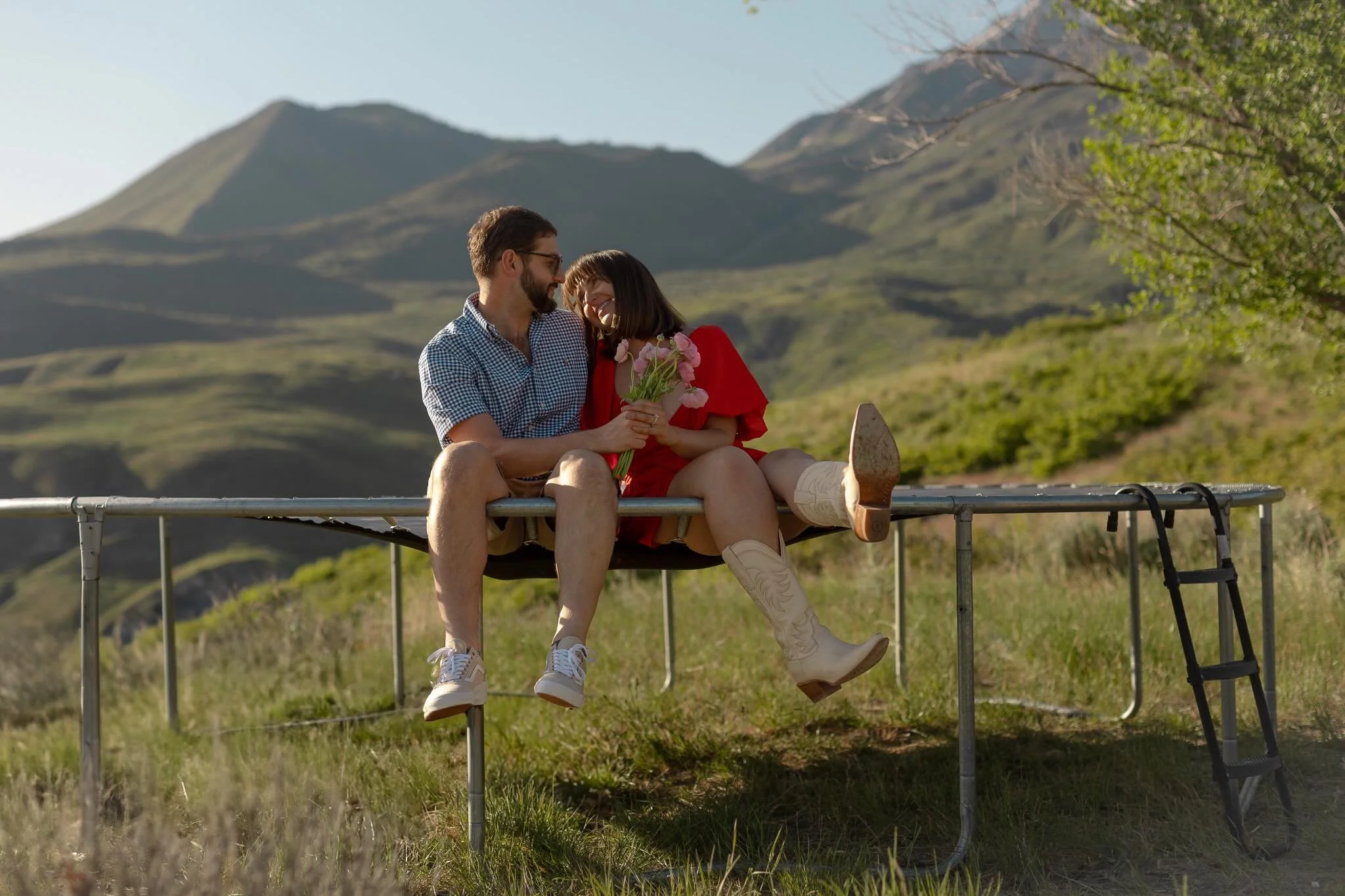 Engaged. And it shows in everything. The way he pulls her in. The way she lets him. We climbed for this light and it gave us everything. This is only the beginning.